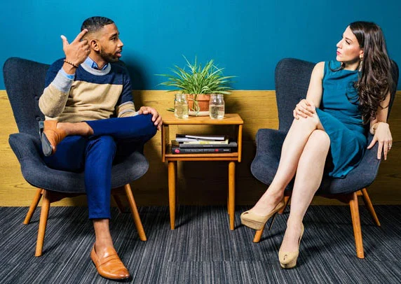 two people displaying workplace body language.jpg
