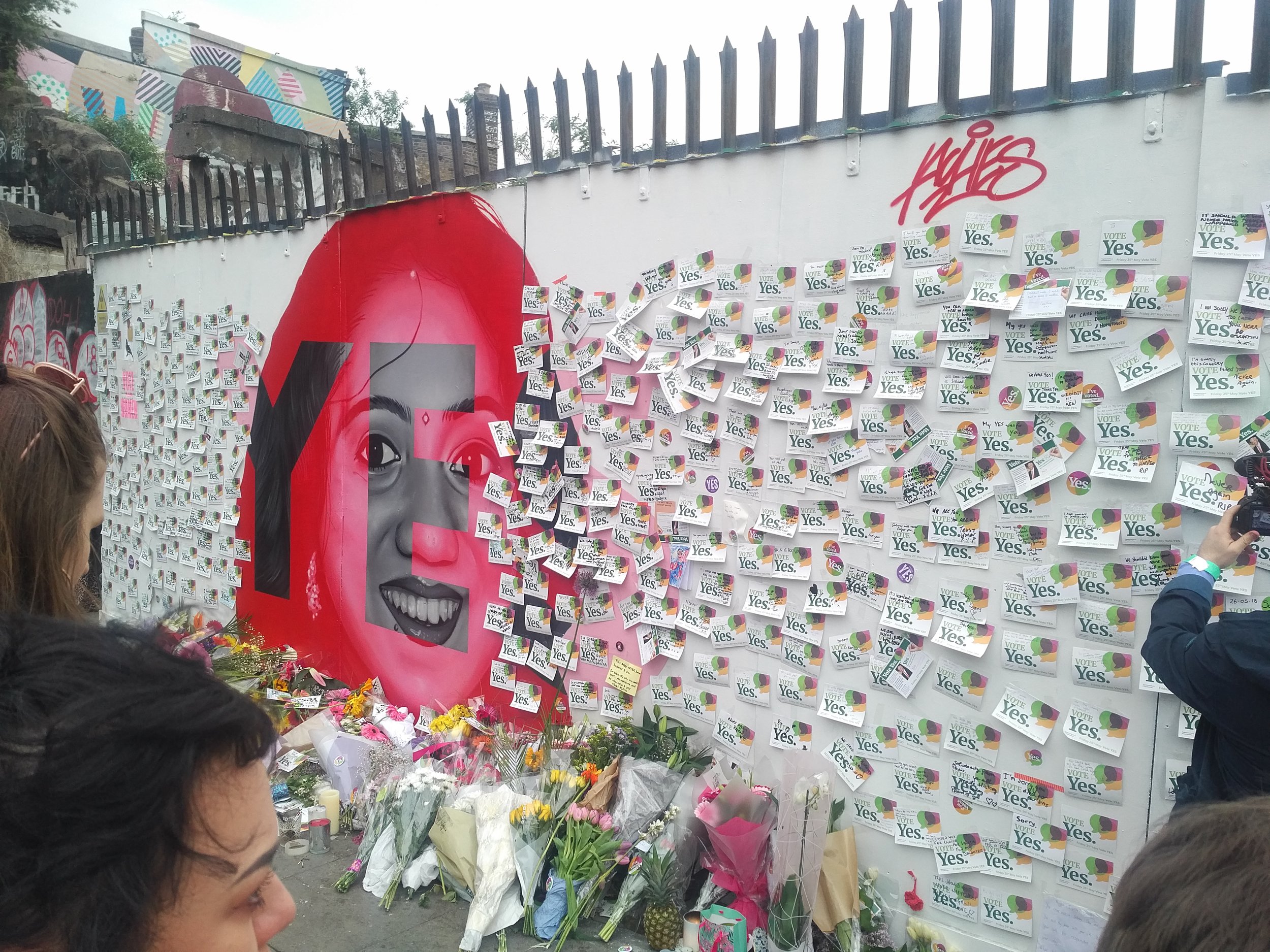 Mural of Savita Halappananavar covered in “Vote Yes” stickers in Dublin, Ireland.