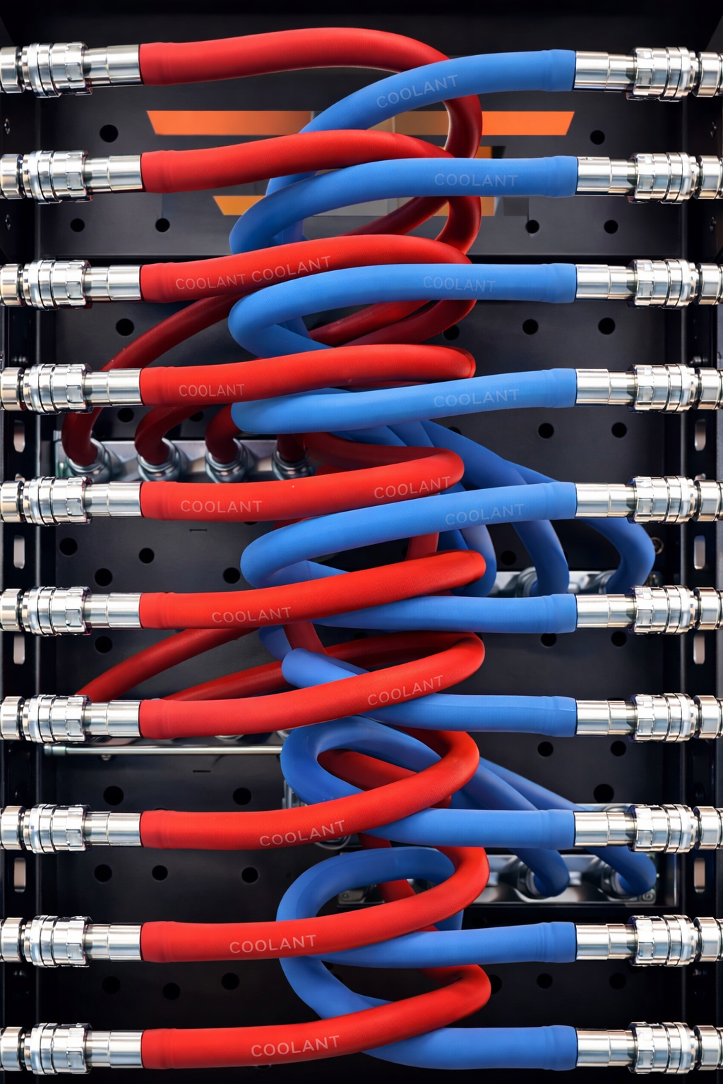 A rack of red and blue coolant hoses intertwined, connected to metal fittings.
