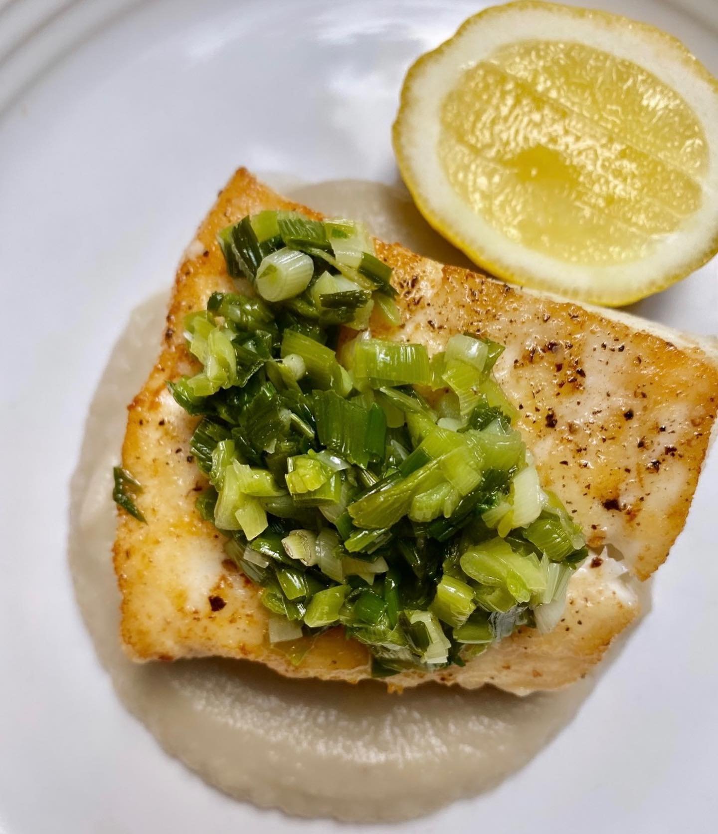 Halibut just how I like it. Seared in olive oil and butter and served with a few exciting flavors we&rsquo;ve all dreamed of all winter, savory yet sweet sunchoke pur&eacute;e and fragrant green garlic, all harvested from the property.