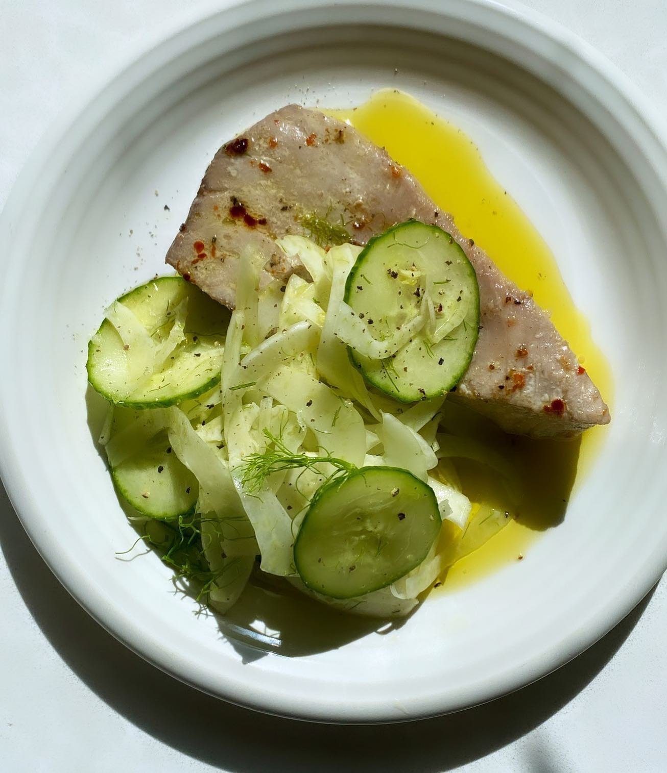 A total sucker for a good tuna salad. This is a fun take on just that. Melt in your mouth tuna confit with a bright, mustardy fennel &amp; cucumber salad for that crunch.