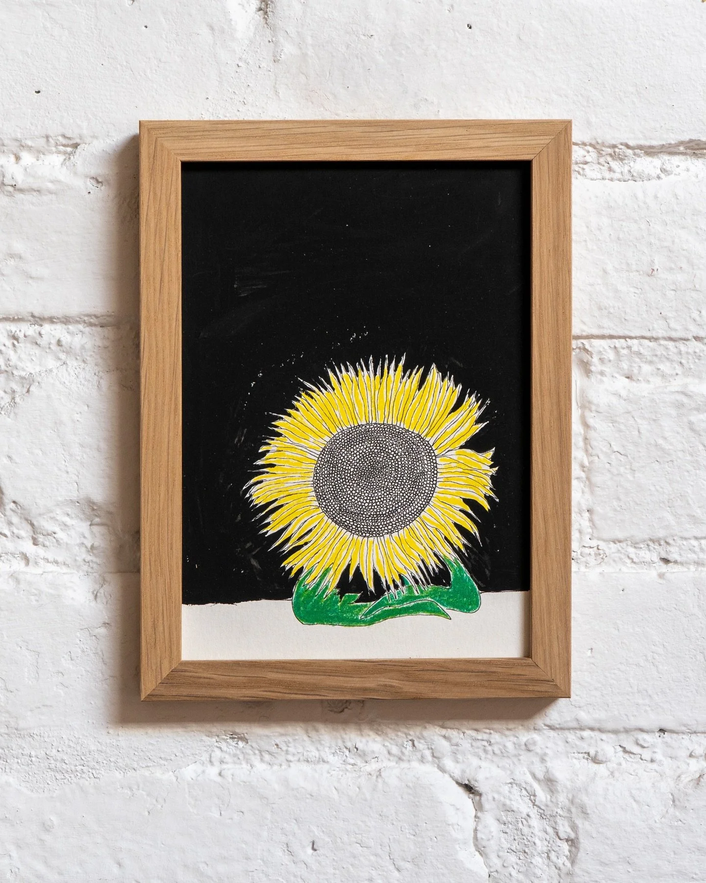 Sunflowers are like us &mdash; heavy-headed but hopeful. In &ldquo;Sunflower at the Bar,&rdquo; I imagined one sitting quietly alone.
 
Maybe it&rsquo;s waiting for someone.
 Maybe it&rsquo;s just watching the world go by.

Whether or not this sunflo
