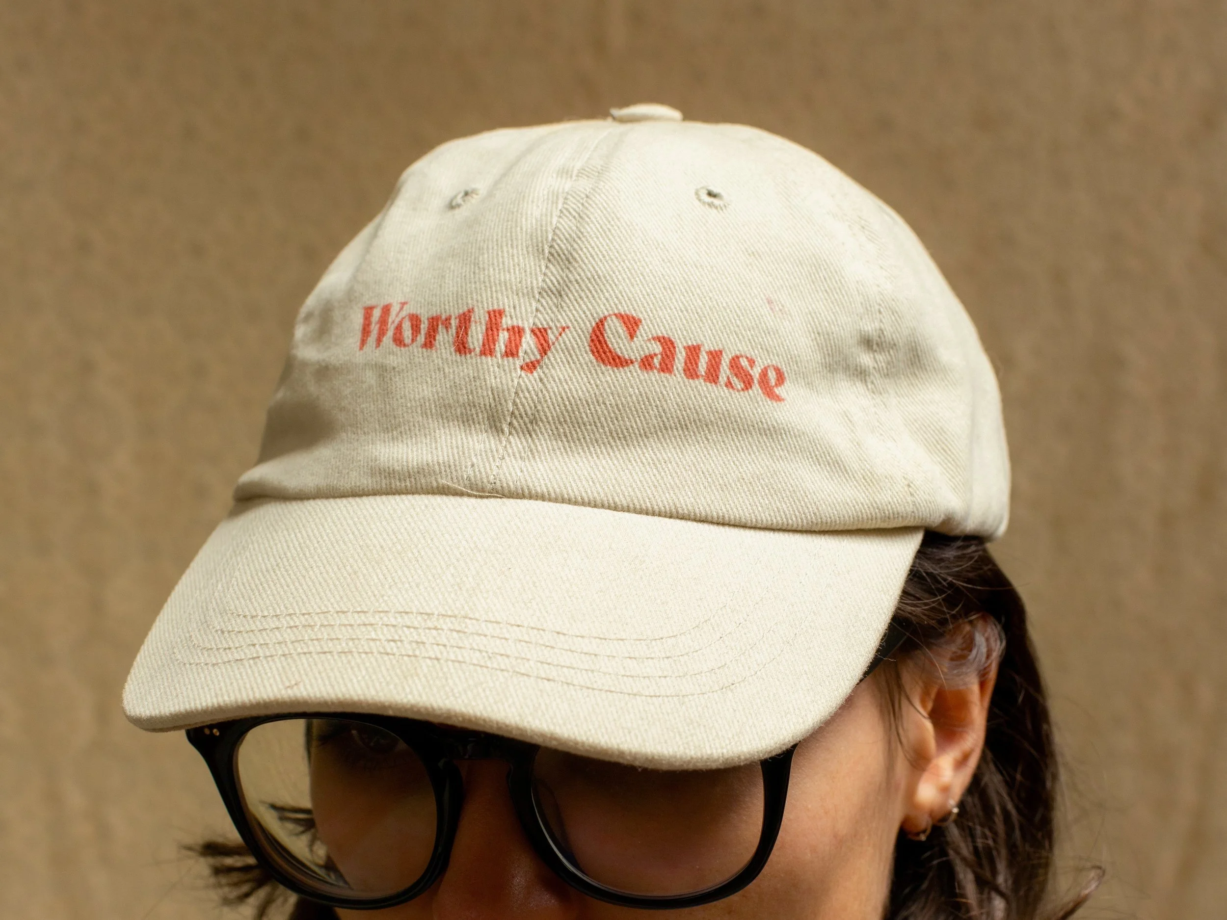 Worthy Cause branded cap photographed by Erhan Tirli