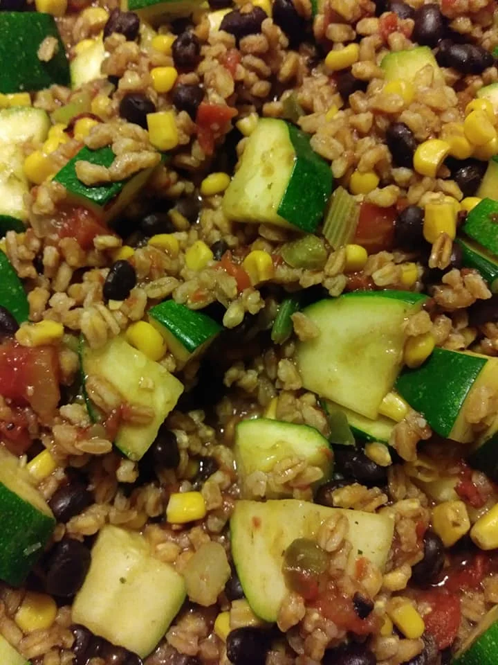 Zucchini with black beans, fire roasted tomatoes and pearled farro
