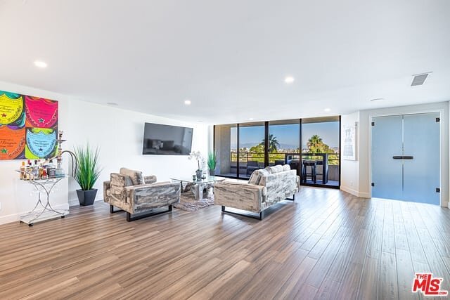 Open floorplan featuring recessed lighting, brand new hardwood flooring and floor to ceiling windows looking out to treetop, mountain, and marina views. If that sounds irresistible, wait til you find out about the amazing location and fantastic Marin