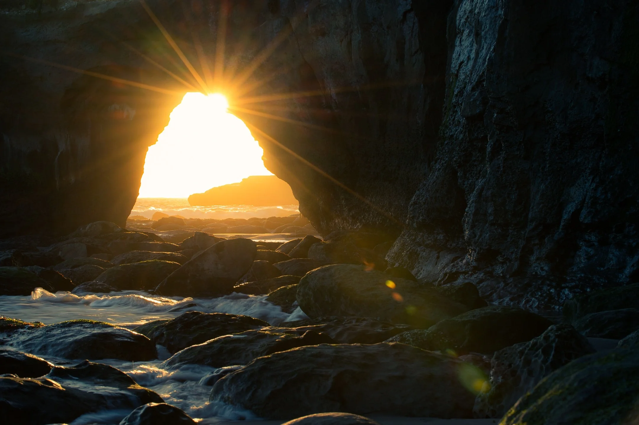 backlit-beach-cave-931910.jpg