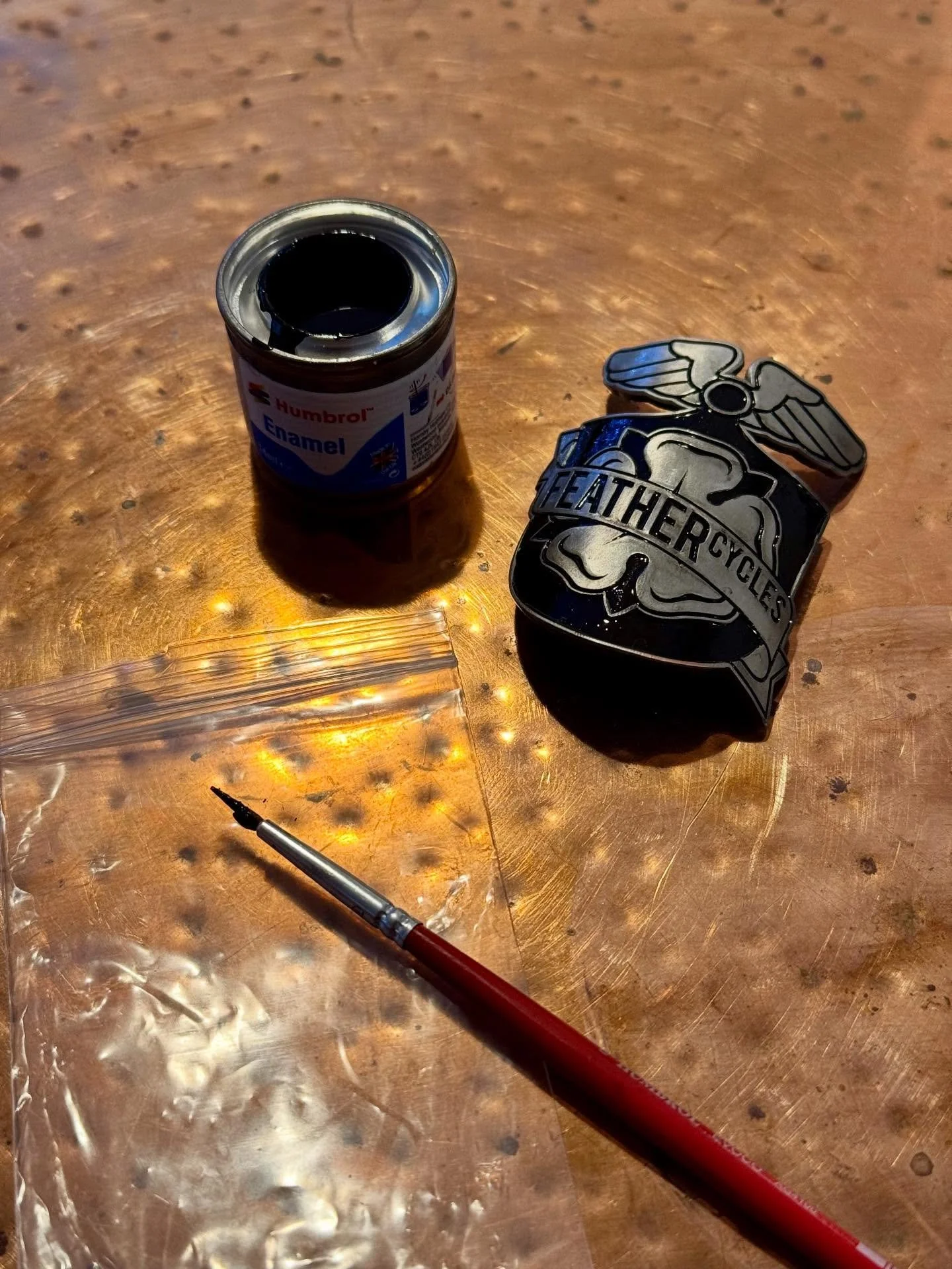 We have a Land Rover Defender inspired road bike currently in the work stand. The customer requested in infilled head tube badge mimicking the retro badge on his Defender, so last I hand painted it for him.