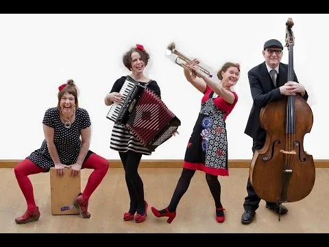 Mary (with the accordion) and the Mudlarks