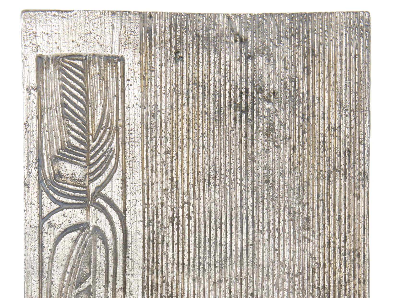 Detail of Angkor Tray in Iridium finish showing abstract botanical relief carving.