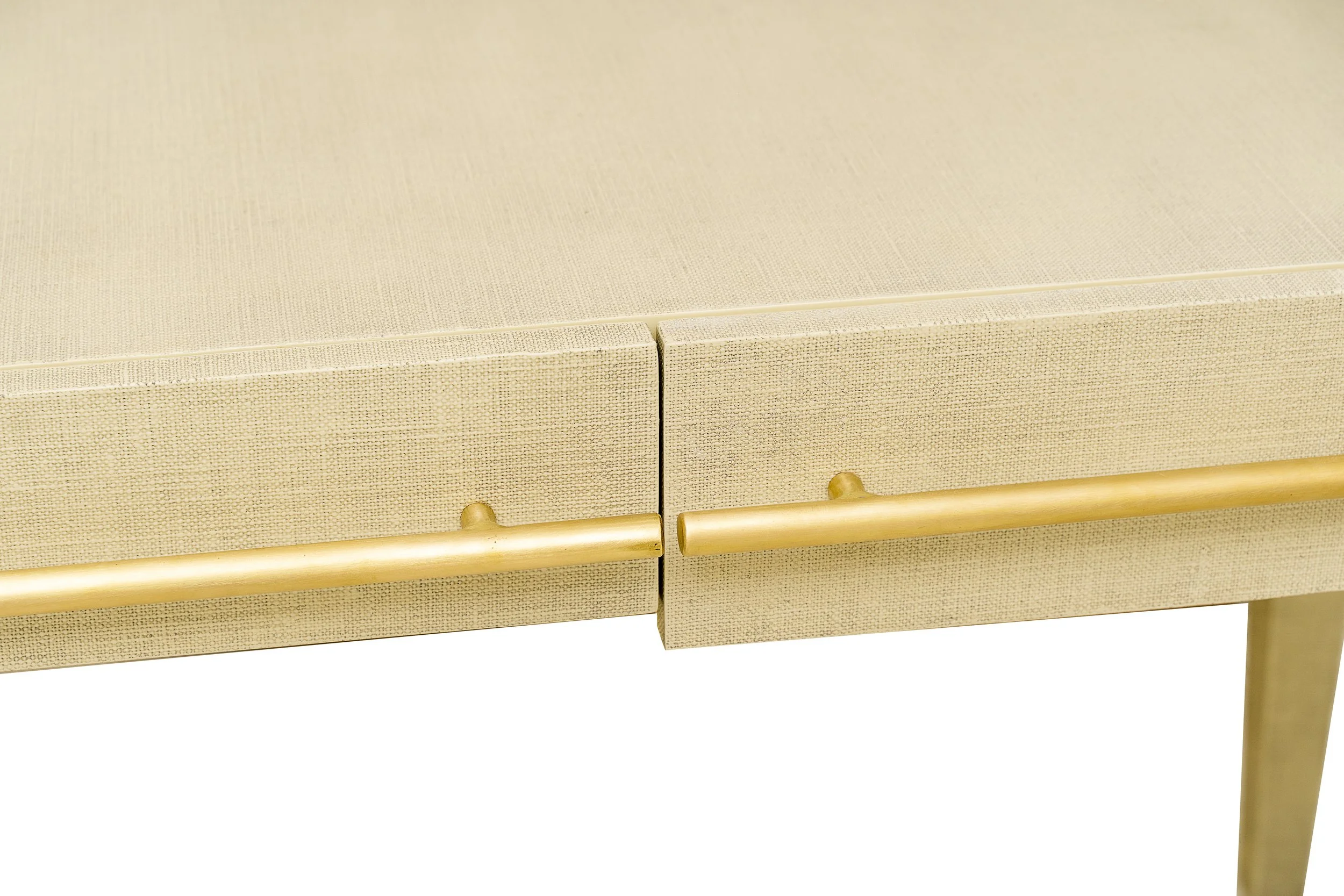 Close up of the I Desk showing Lacquered Linen texture and bronze handles.