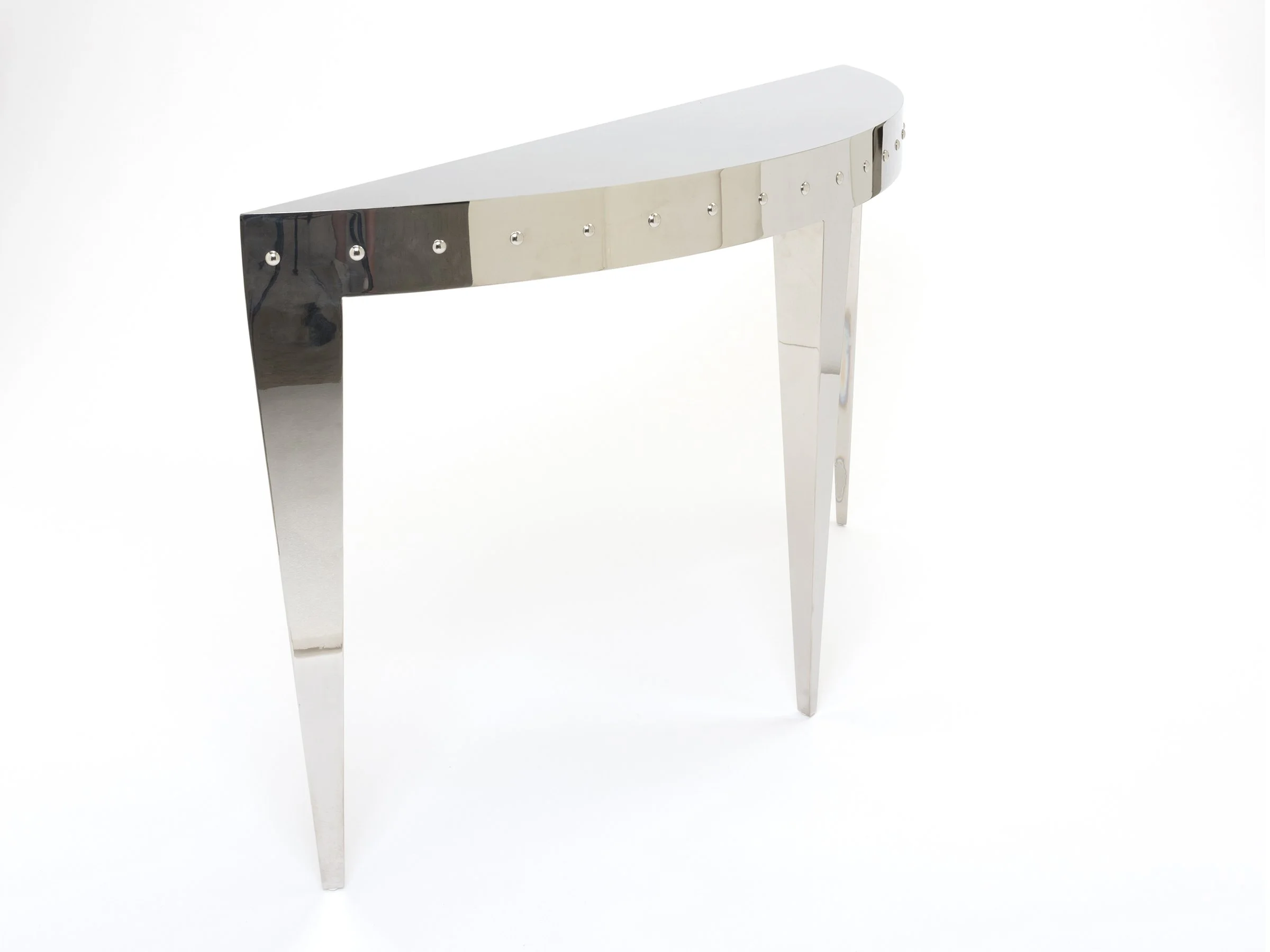 Angle view of Ellipse Console – symmetrical three-leg design shown in mirror polished stainless steel finish