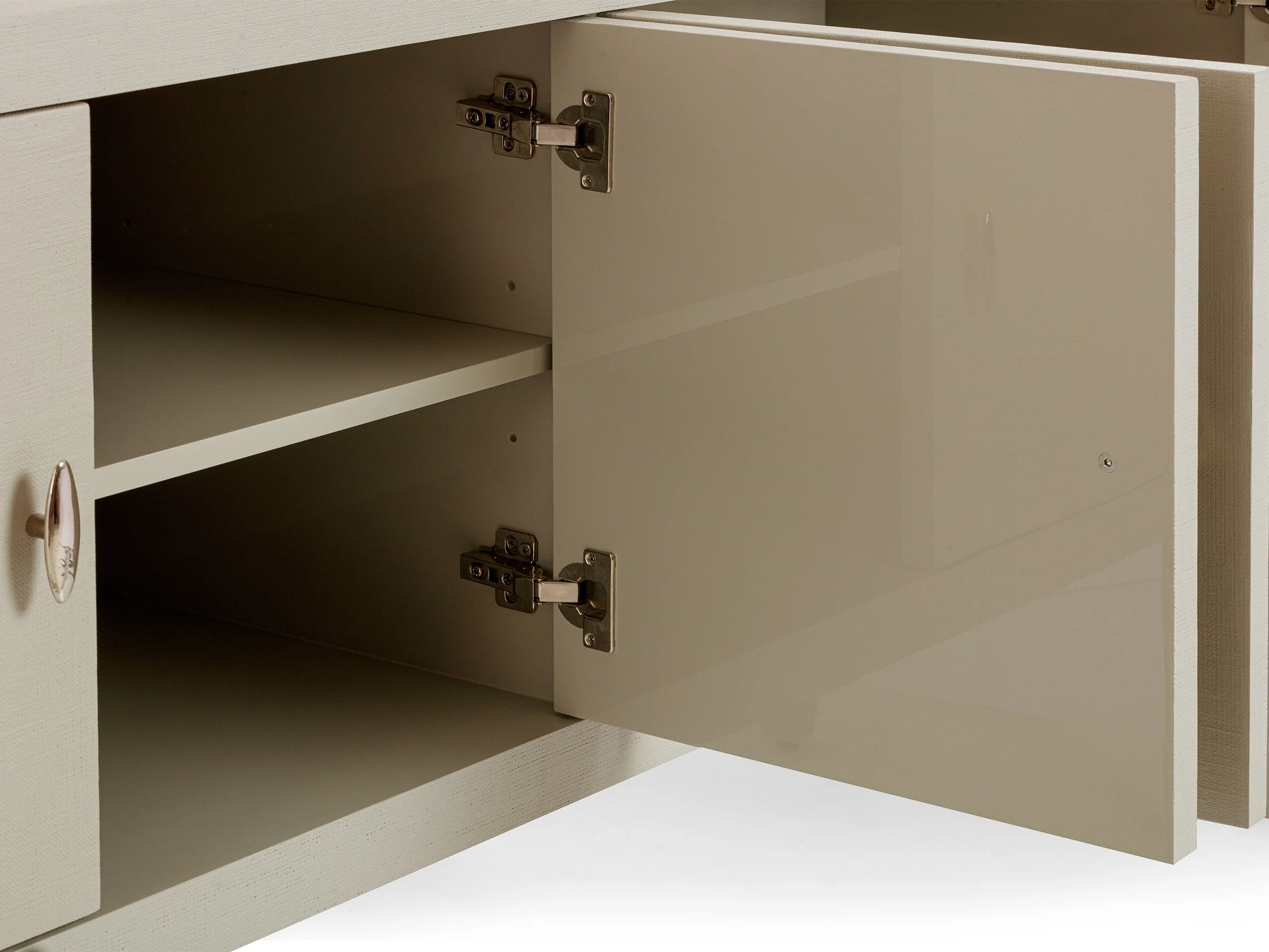 Detail view of Matthew 4-Door Cabinet revealing interior storage