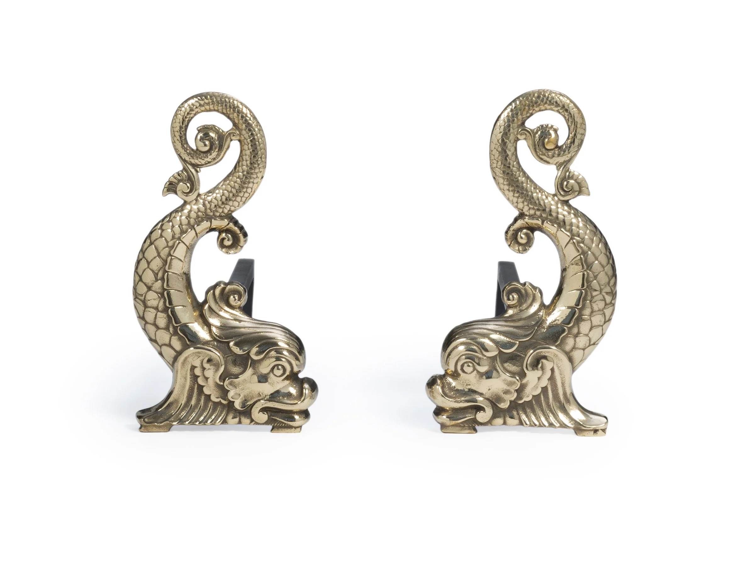 Front view of Dauphin Andirons in polished bronze, dolphin-form heads with curled tails.