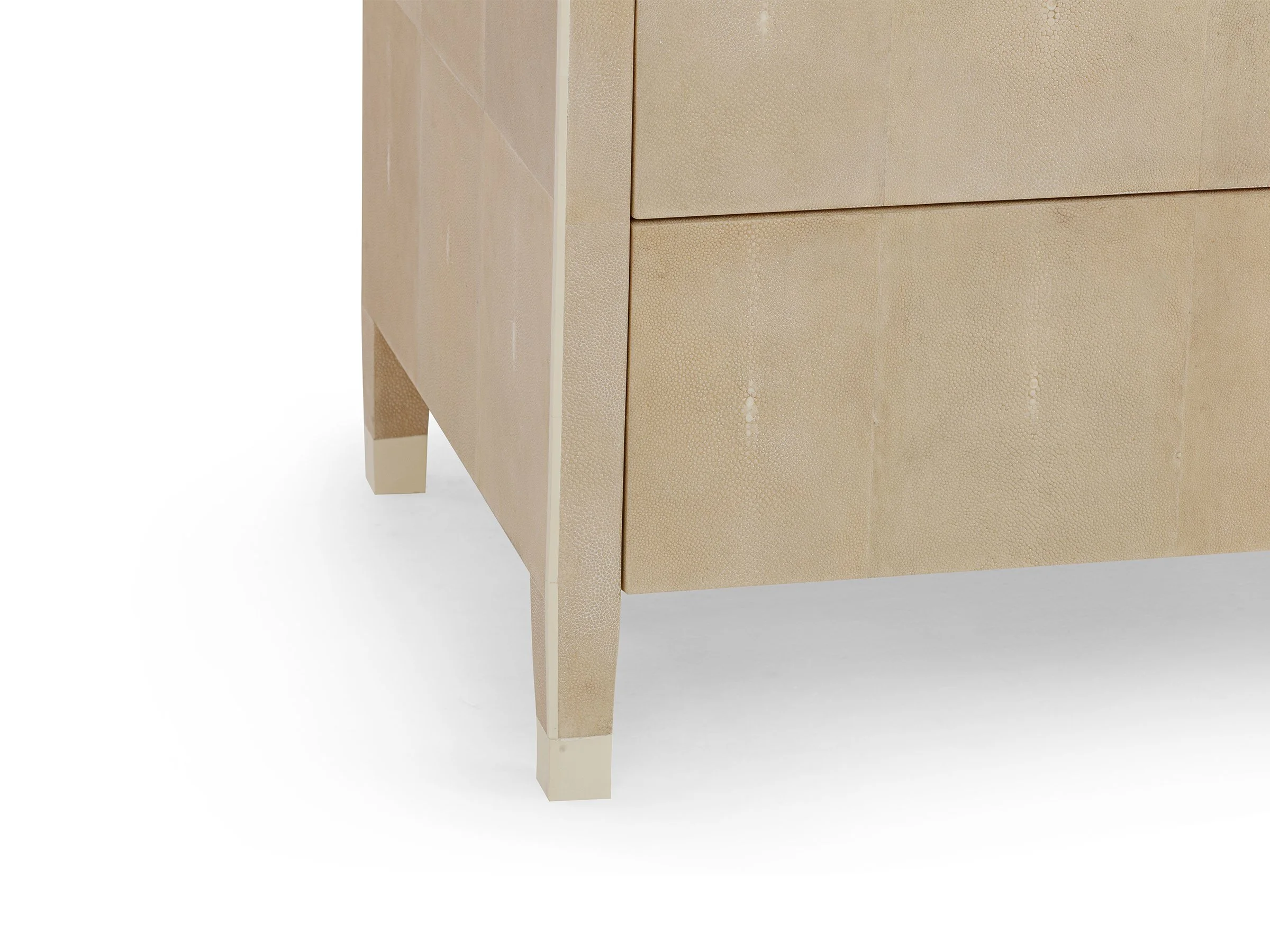 Detail view of Matthew Chest in Antique shagreen with bone hardware showing sabots on legs.