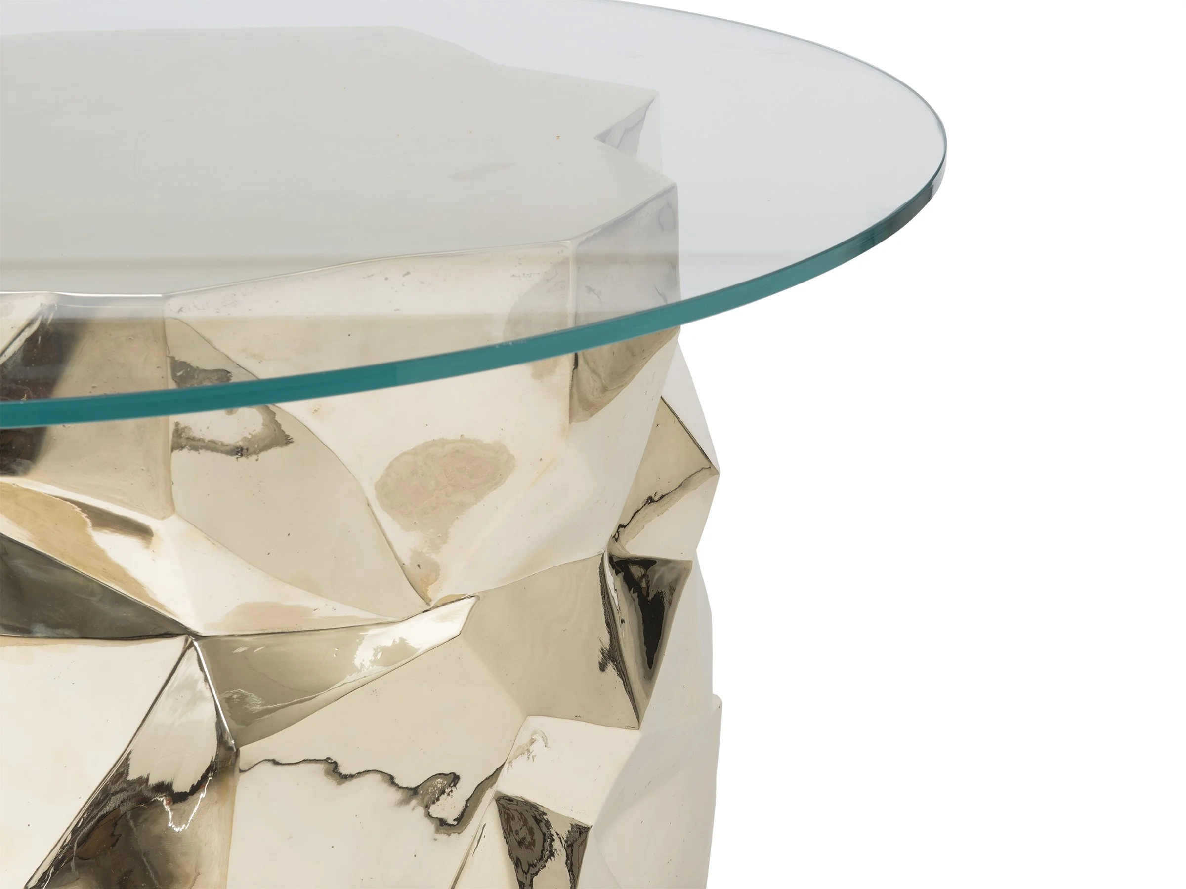 Detail view of the Facet Dining Table with round glass top and faceted bronze base