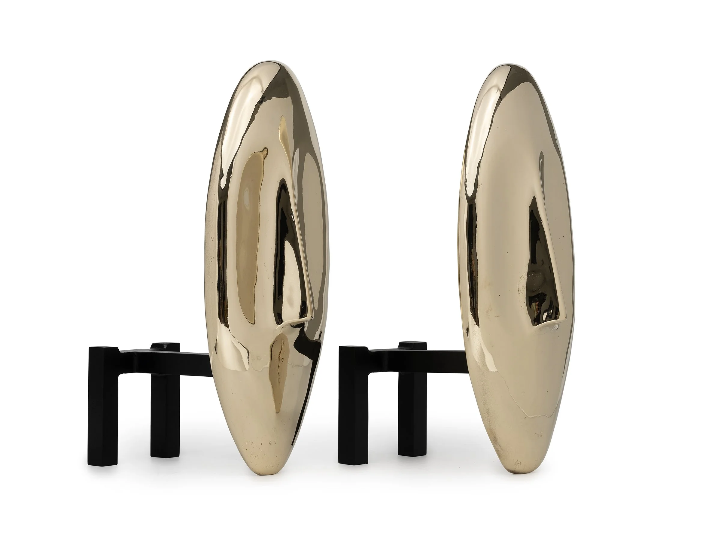 Angled view of Face Andirons showing depth and sculptural curvature