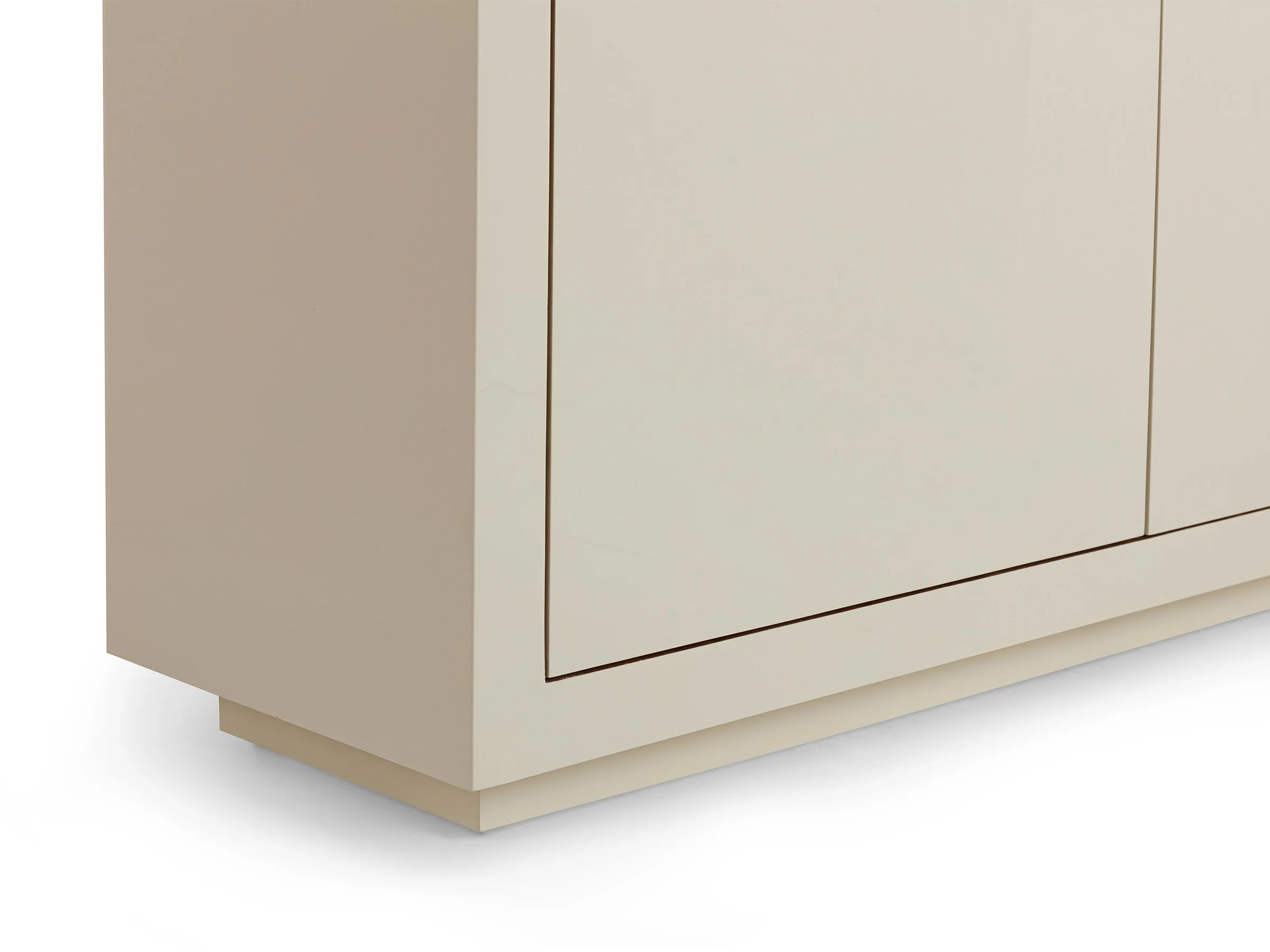 The Soleil Armoir in biscuit lacquer with polished bronze sunburst hardware, detail view