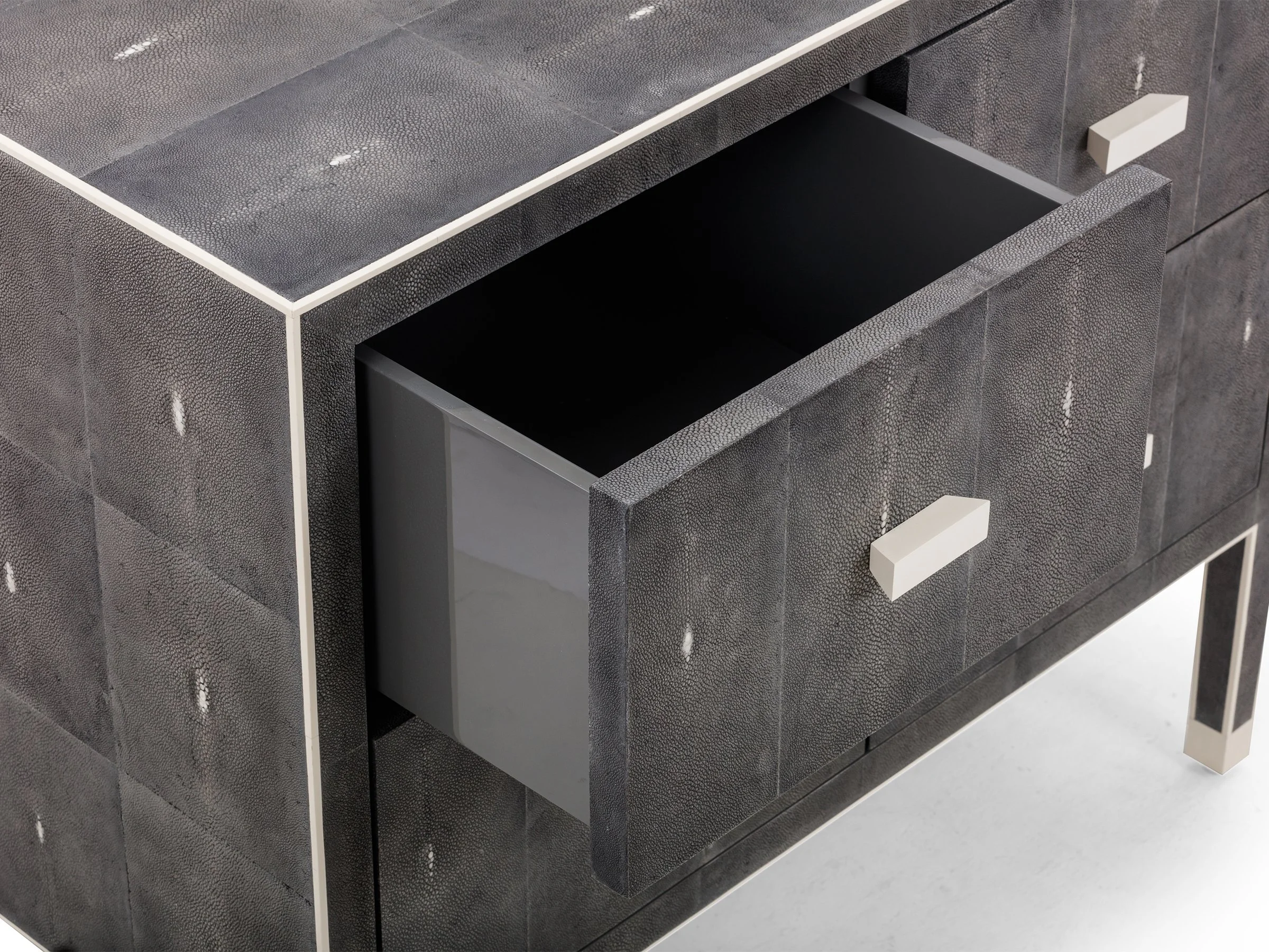 Detail view of The Matthew Dresser in Onyx Shagreen with Bone handles showing drawer open
