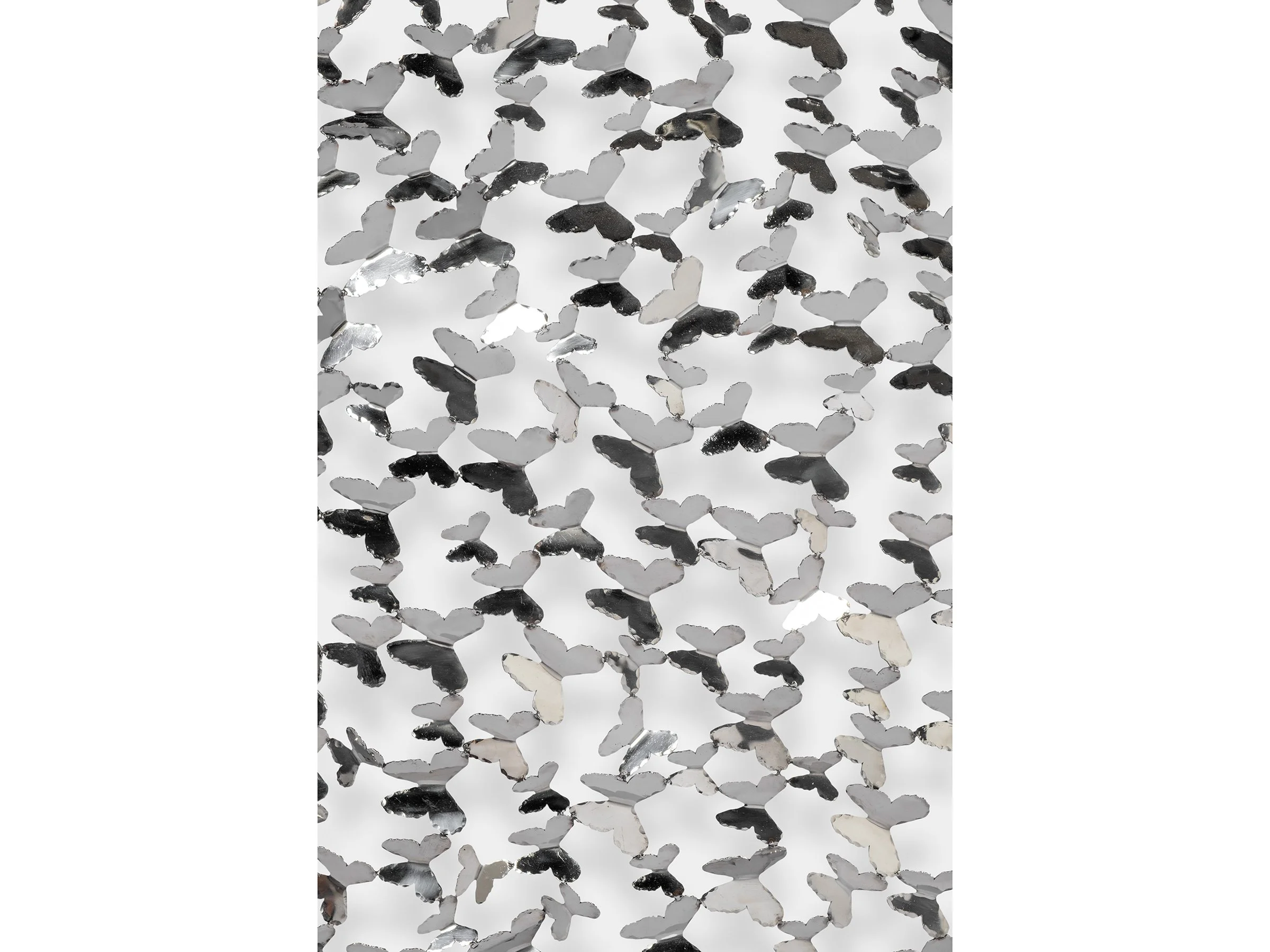 Close-up detail of hand-cut mirrored butterflies forming the screen.