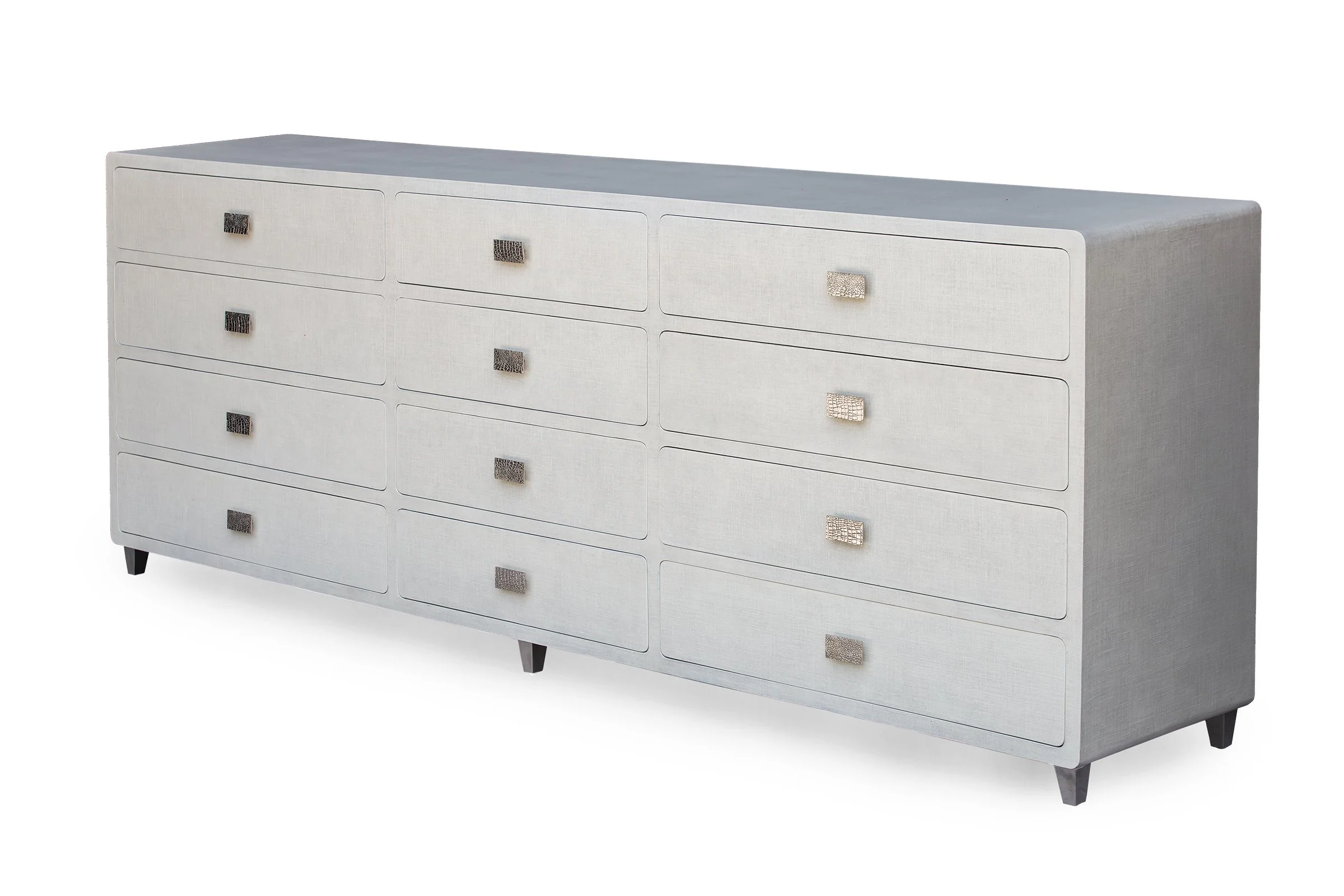 Front angle view of the Glenn Long Dresser with bronze “alligator” handles in Snow Lacquered Linen