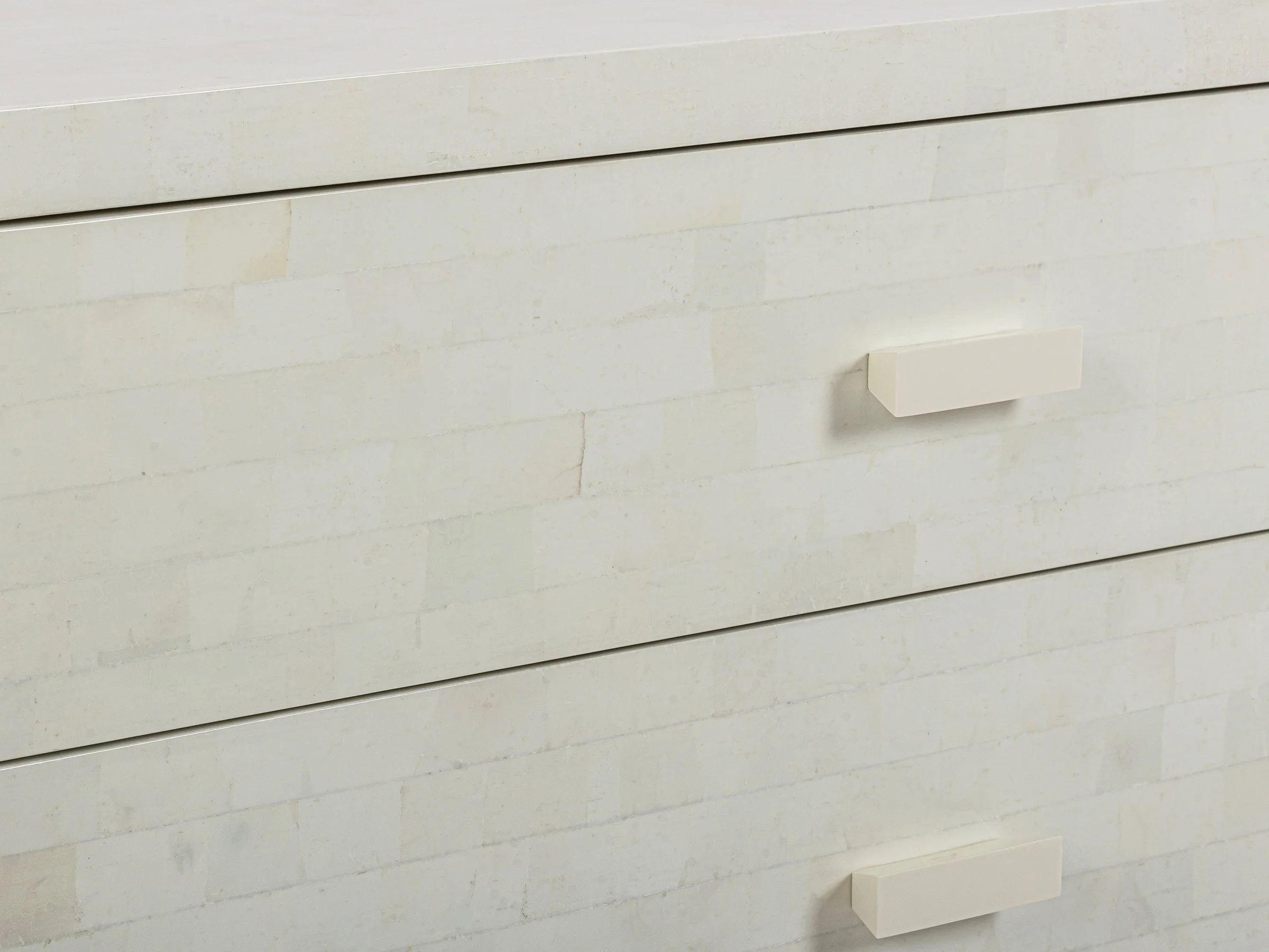 Detail view of the Double Matthew Chest in White Brushed Eggshell Lacquer showing bone handles