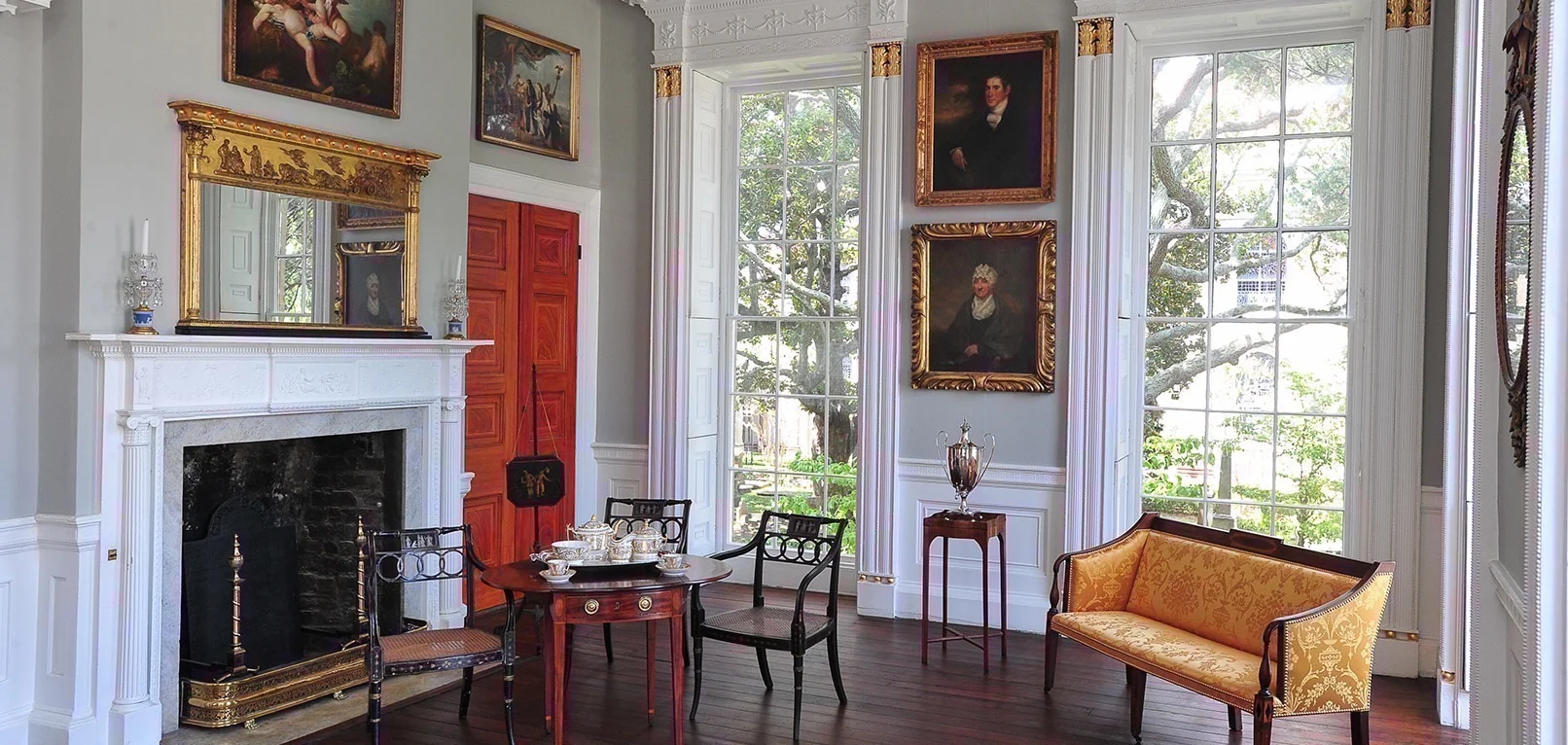 Withdrawing Room of Nathaniel Russell House with portrait of Jonathan Lucas by John Wesley Jarvis (top) and portrait of Susannah B. Smiley by Samuel Morse (Bottom)