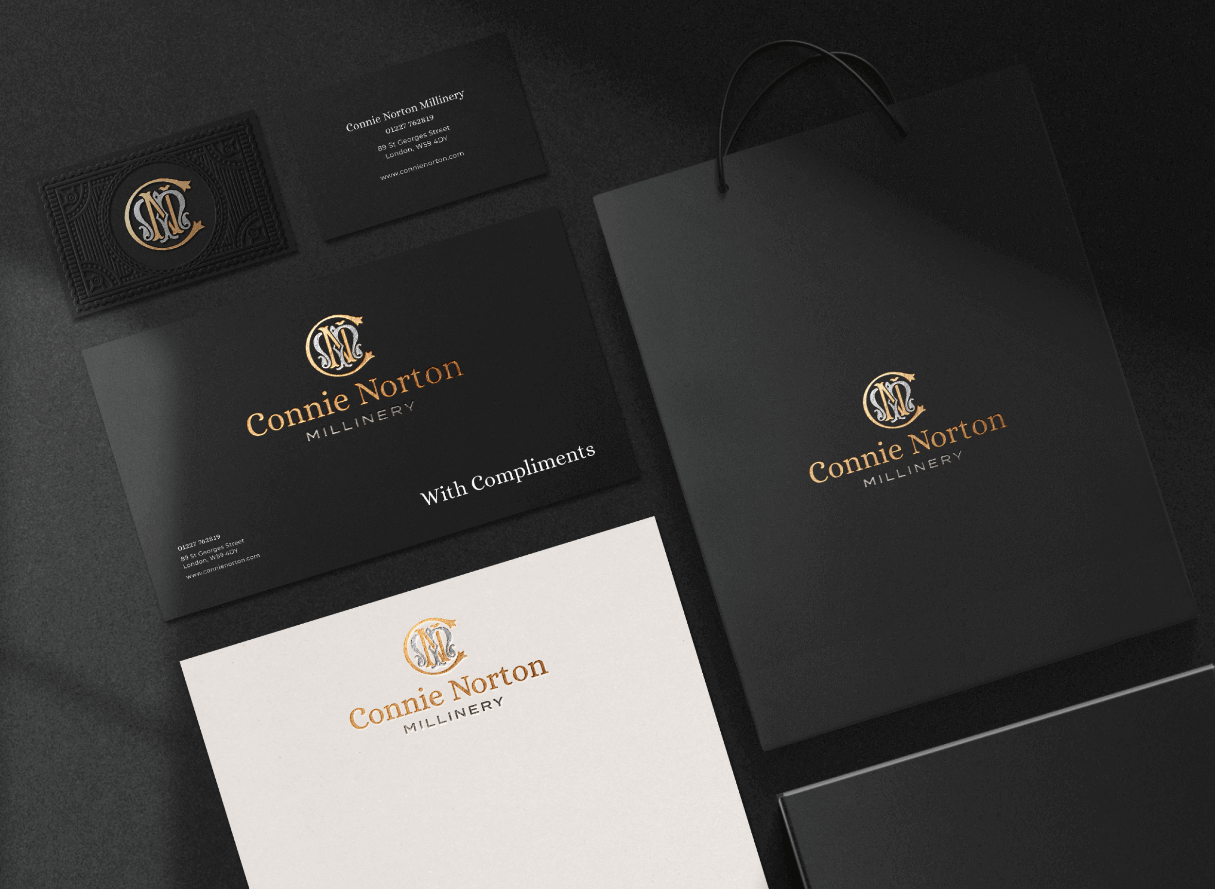 Business branding materials for Connie Norton Millinery, including a black business card, a black envelope, a white paper with the logo, and a black shopping bag with the logo.