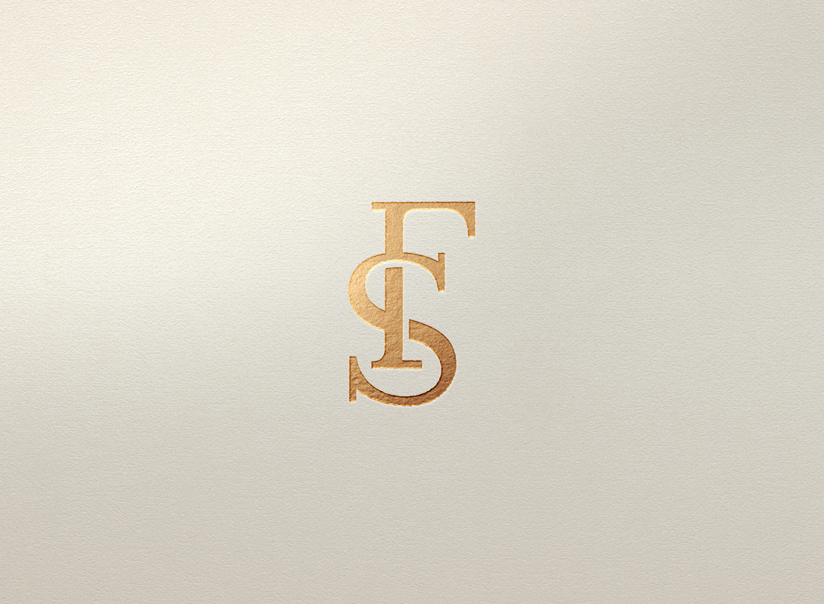 Minimalist logo with intertwined gold letters T, S, and G on a beige textured background.