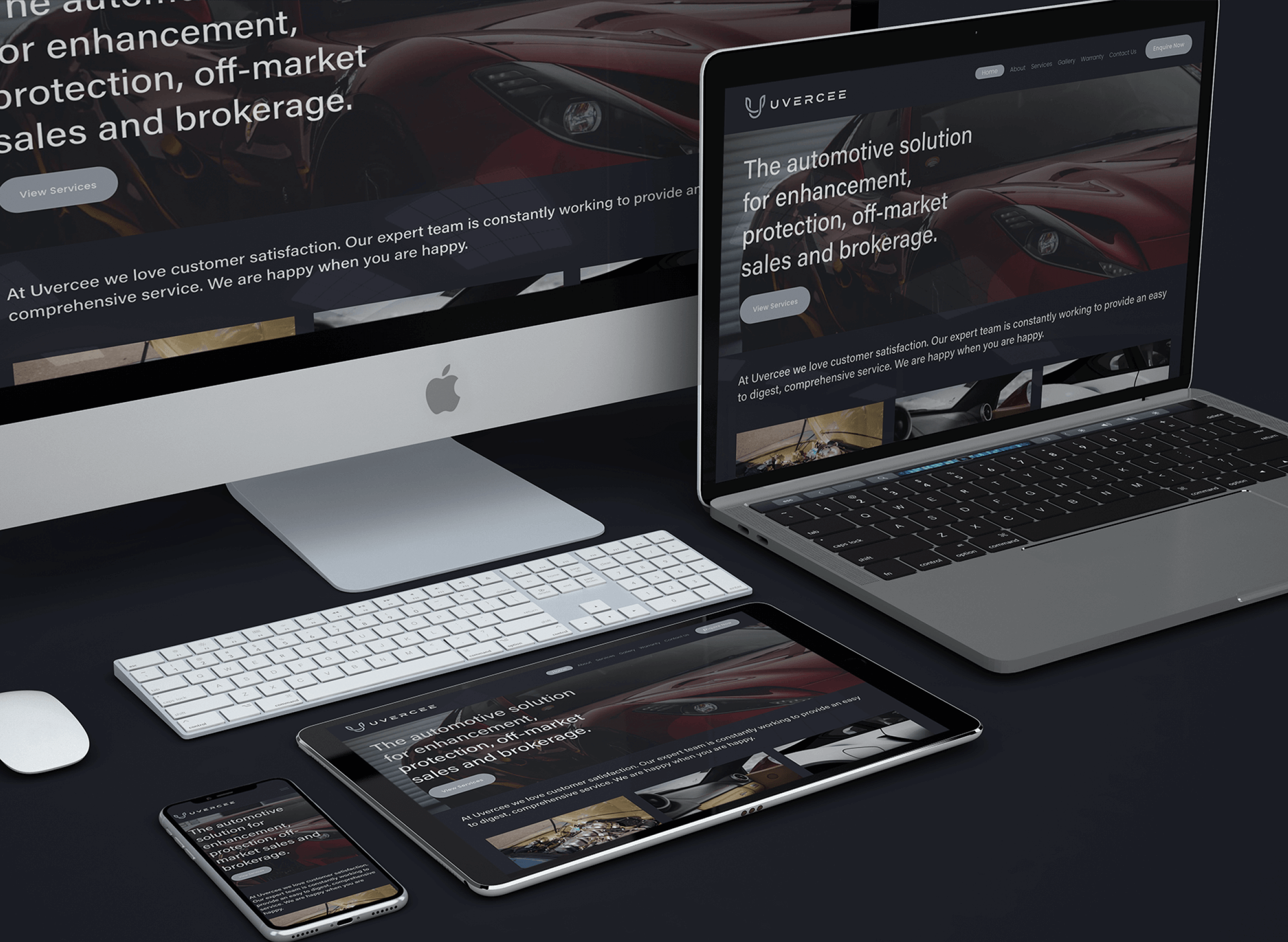 Multiple Apple devices, including an iMac, MacBook, iPad, and iPhone, displaying the same automotive services website on a dark desk.