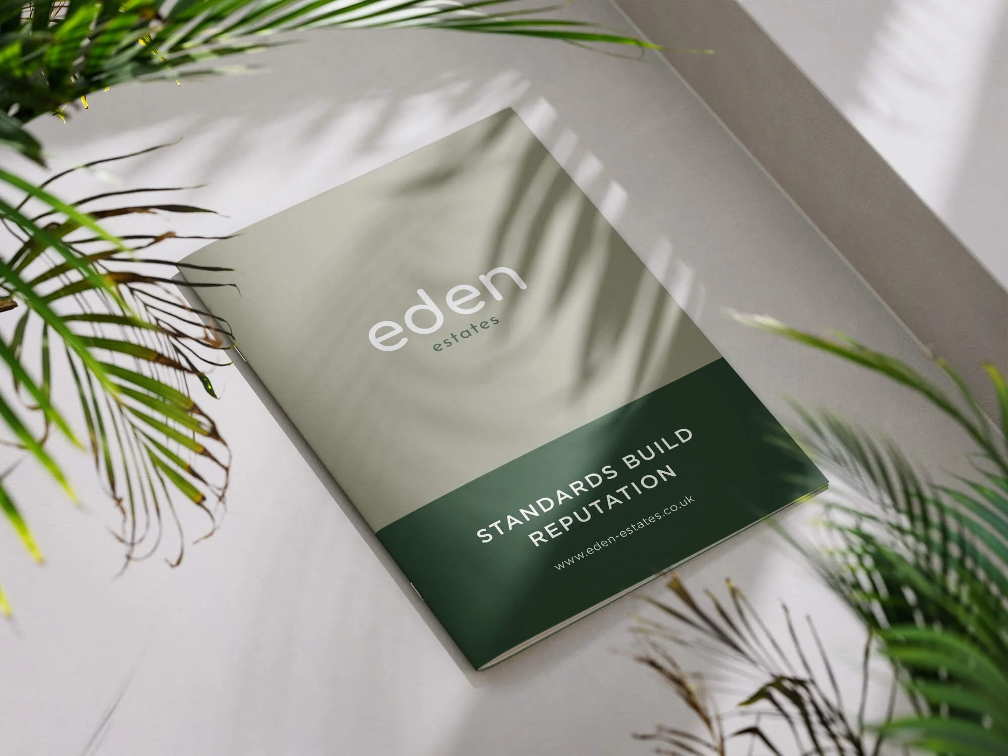 Brochure for Eden Estates with the slogan "Standards Build Reputation" and the website www.eden-estates.co.uk, surrounded by green plants.