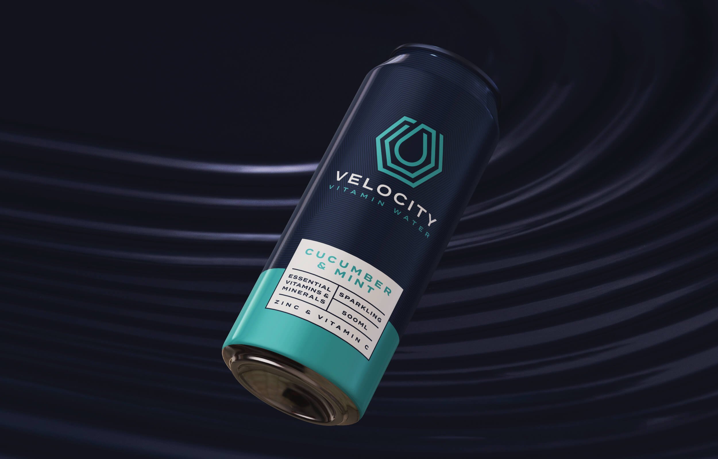 A can of VELO CITY vitamin water with cucumber and mint flavor on a dark surface with light streaks.