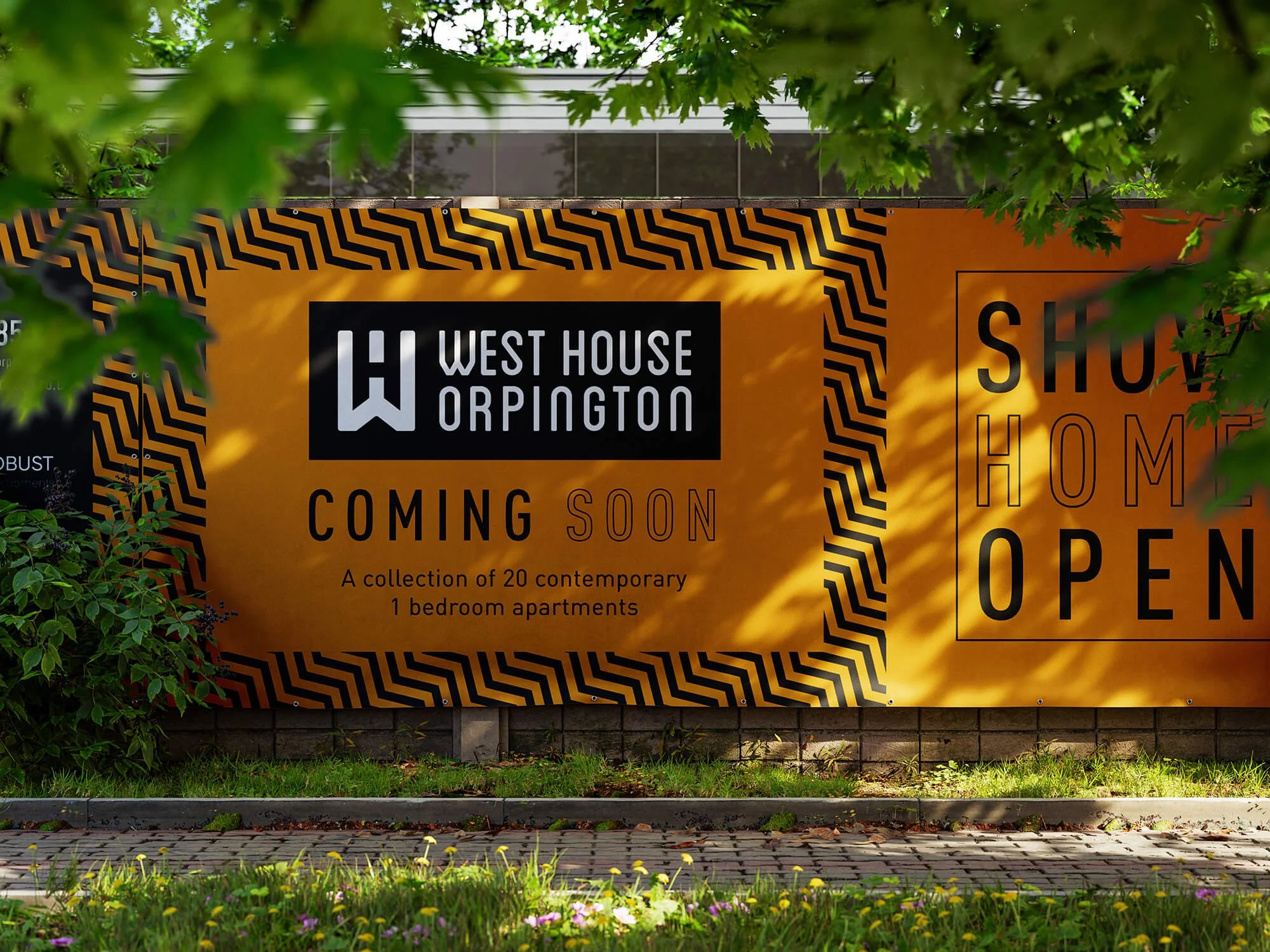 Construction sign for West House Orpington, announcing new collection of one-bedroom apartments, with the message 'Coming Soon' and 'Show Home Open', set on a yellow and black patterned background, surrounded by greenery.