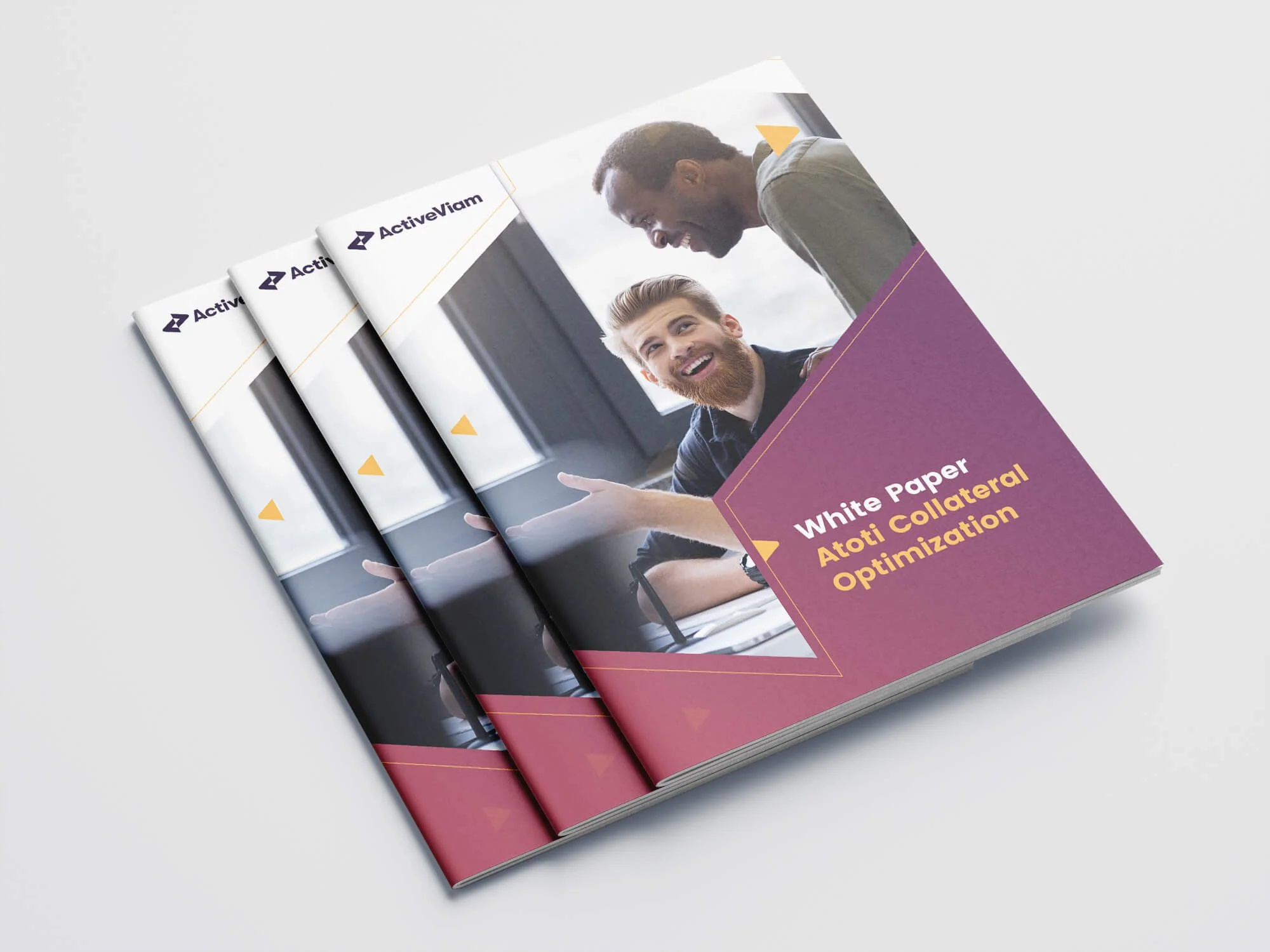 Three copies of a printed brochure titled 'White Paper Atori Collateral Optimization,' featuring a smiling man with a beard and a man with dark skin in a conversation, on a white surface.
