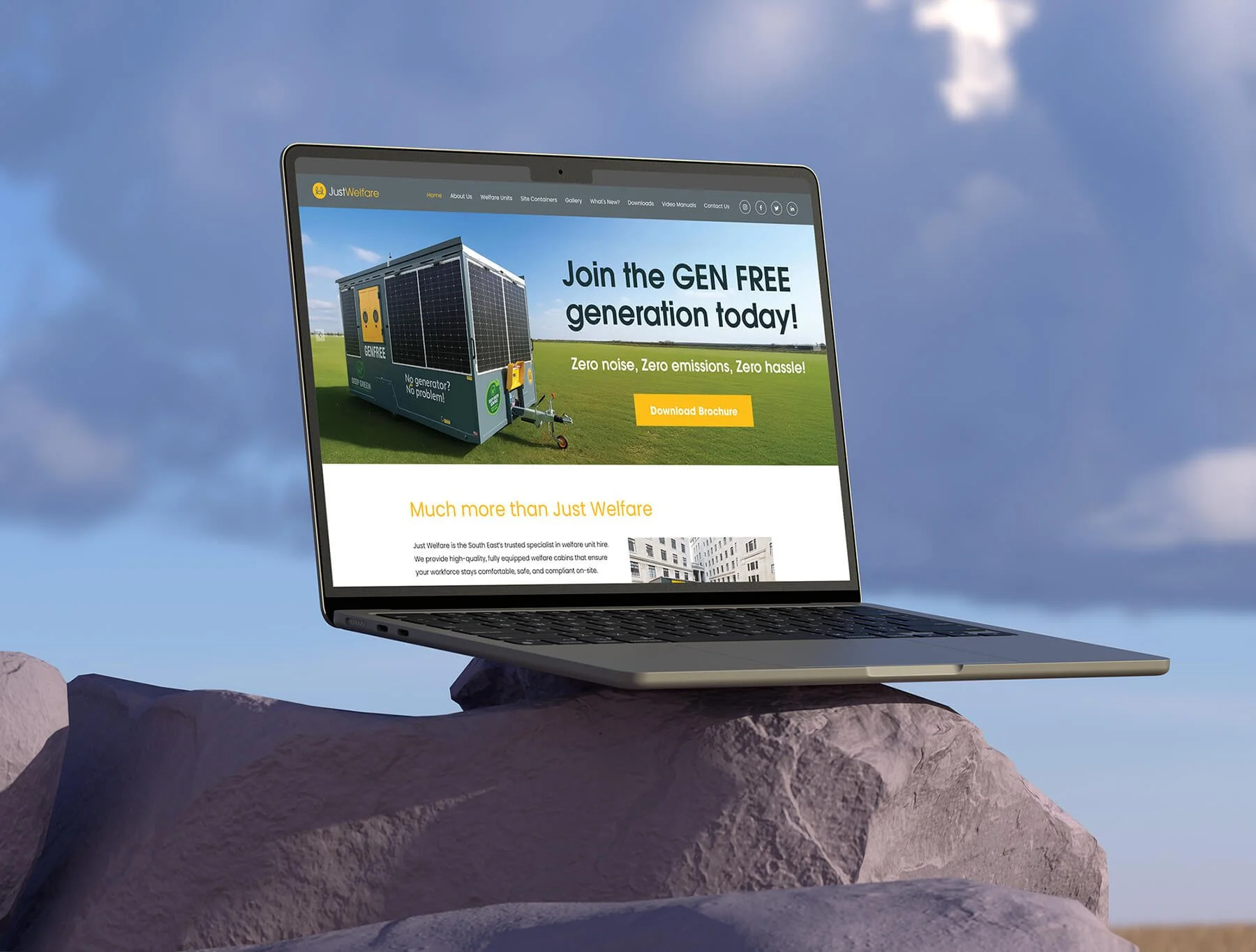 Laptop on a rock displaying a webpage about green energy solutions, with a blue sky and clouds in the background.
