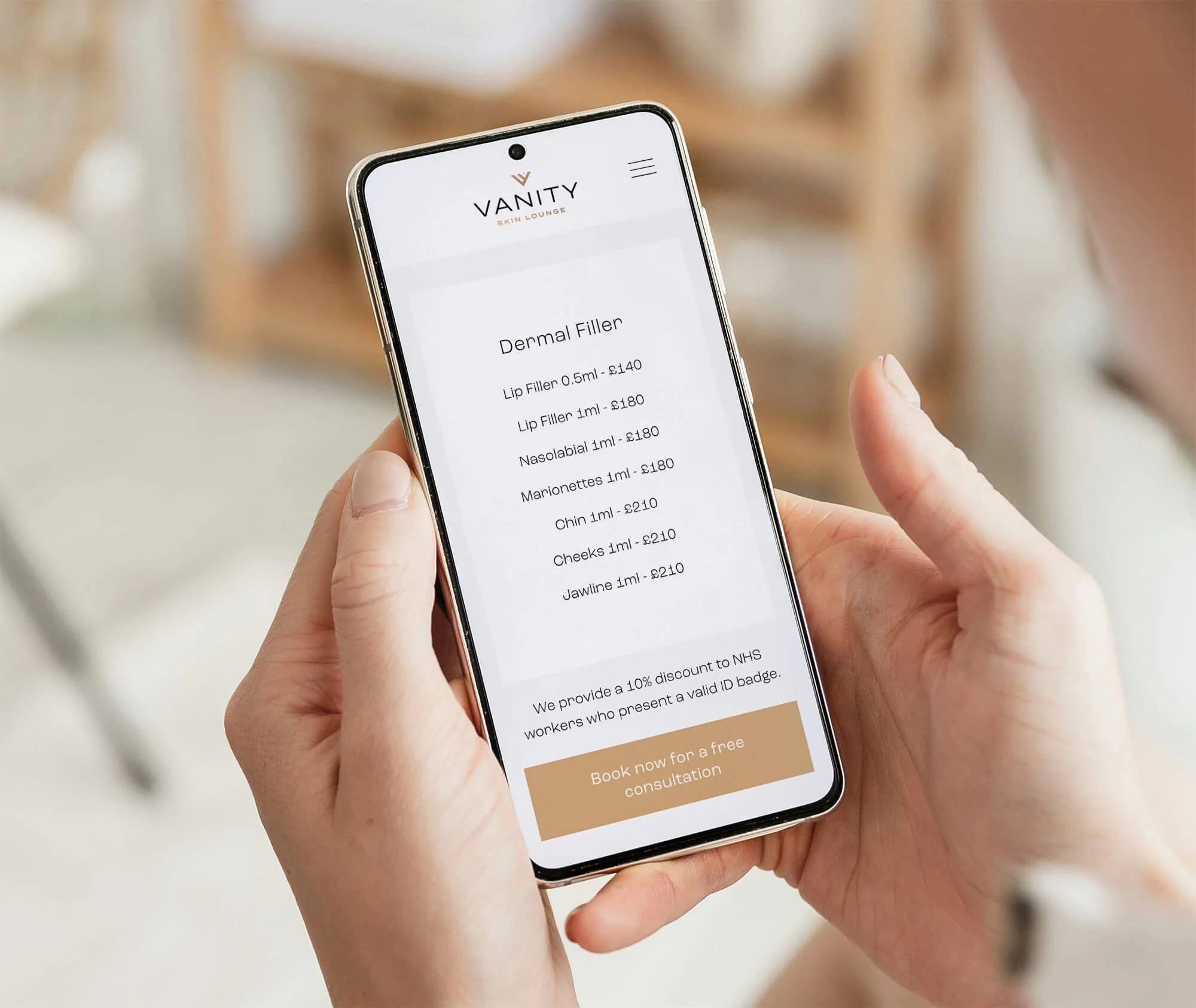 Person holding a smartphone displaying a menu for a skin aesthetic clinic, including prices for dermal fillers and a button for booking a free consultation.