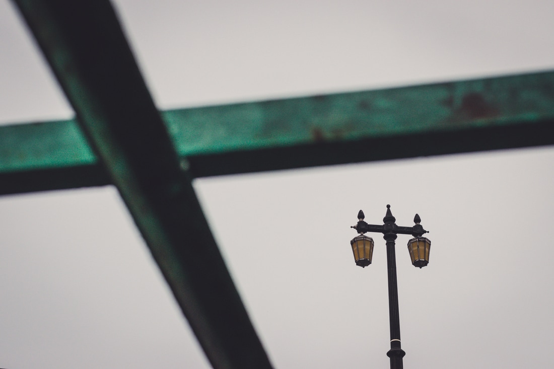 Framed post lamp on a bridge