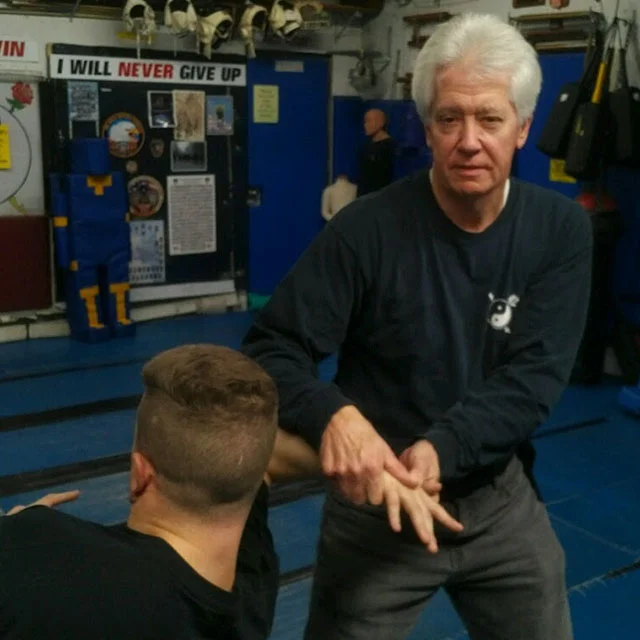Ken Johnson joined Modern Warrior in 2002. He became an assistant instructor in the Bo Fung Do weekly martial arts program the next year. He has assisted with Female Self Defense courses, Self Defense Key Chain classes, Confined Area Safety & Survival Tactics (CAST) and many other classes held at Modern Warrior, as well as off-site locations throughout Long Island. Ken is a certified Modern Warrior instructor for various training programs, including Rape Prevention, Tactical Edged Weapons Defense, CAST and Combat Physiokinetics. He earned his black belt in 2013 and currently acts as a lead instructor for the Bo Fung Do weekly martial arts program.