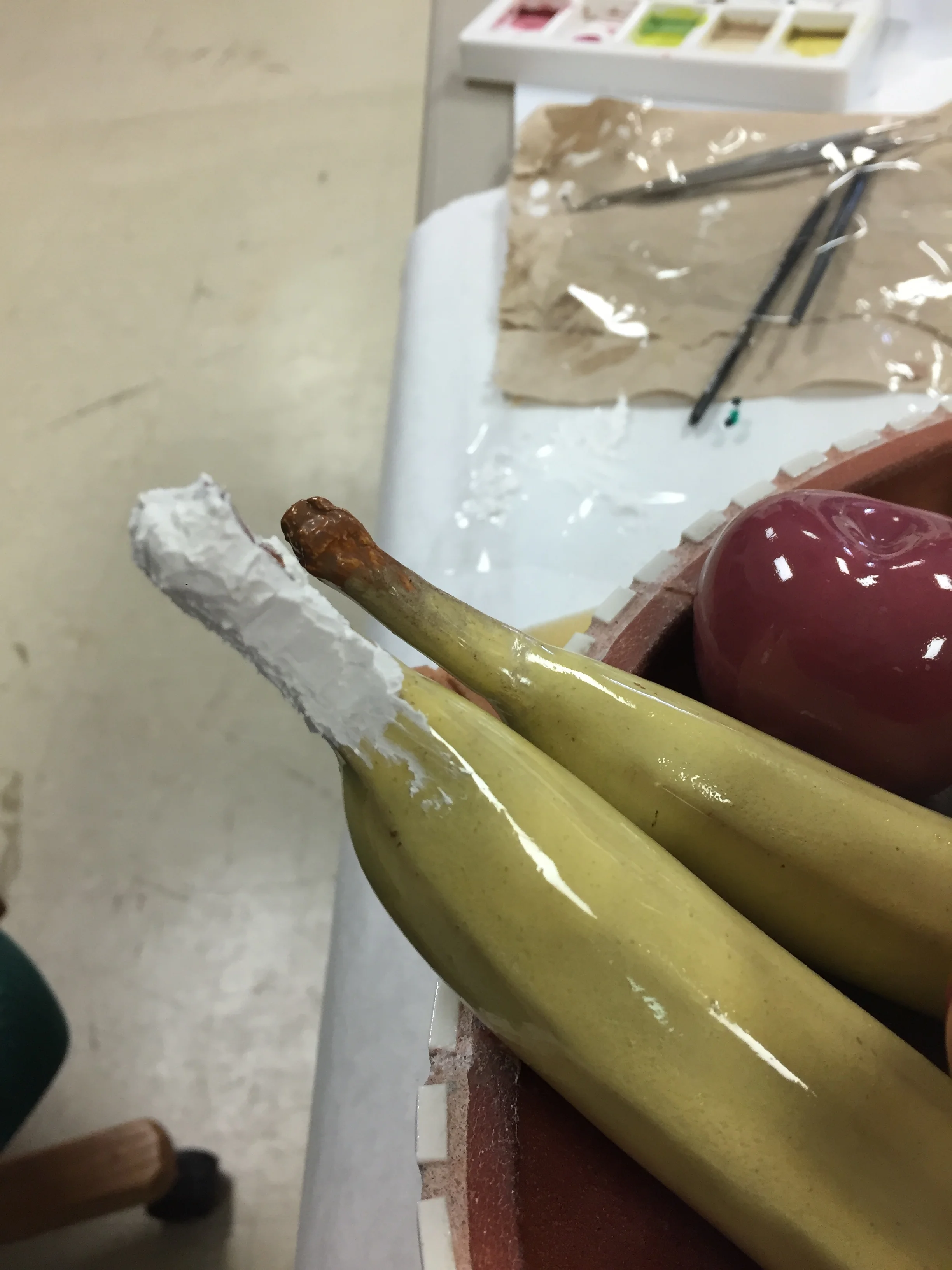  After cleaning and bonding, areas of loss on the fruit were filled.  