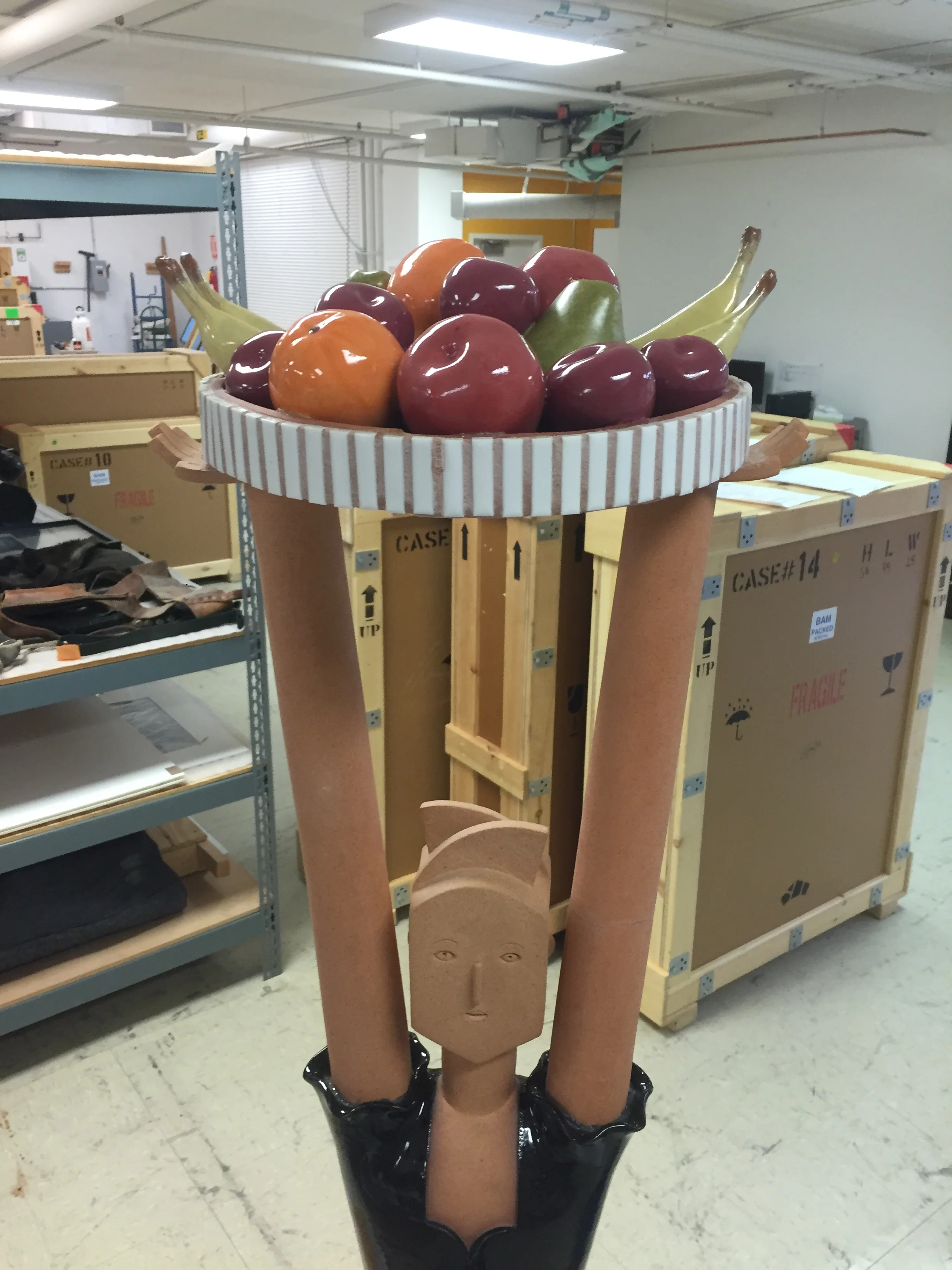  The fruit plate was then remounted atop the now stable arms of the sculpture. 