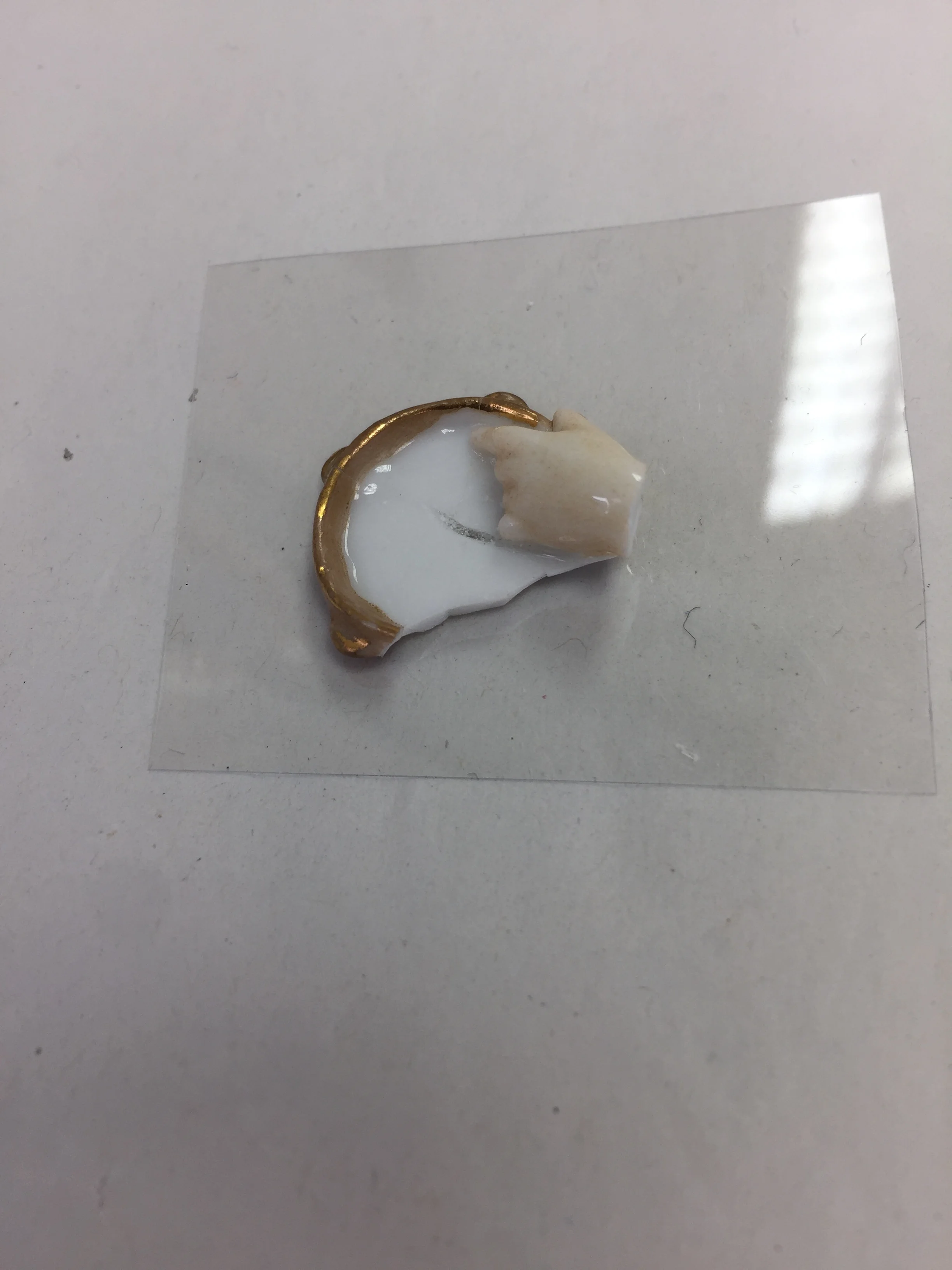  Existing sections of the tambourine were bonded together separate from the rest of the object. 