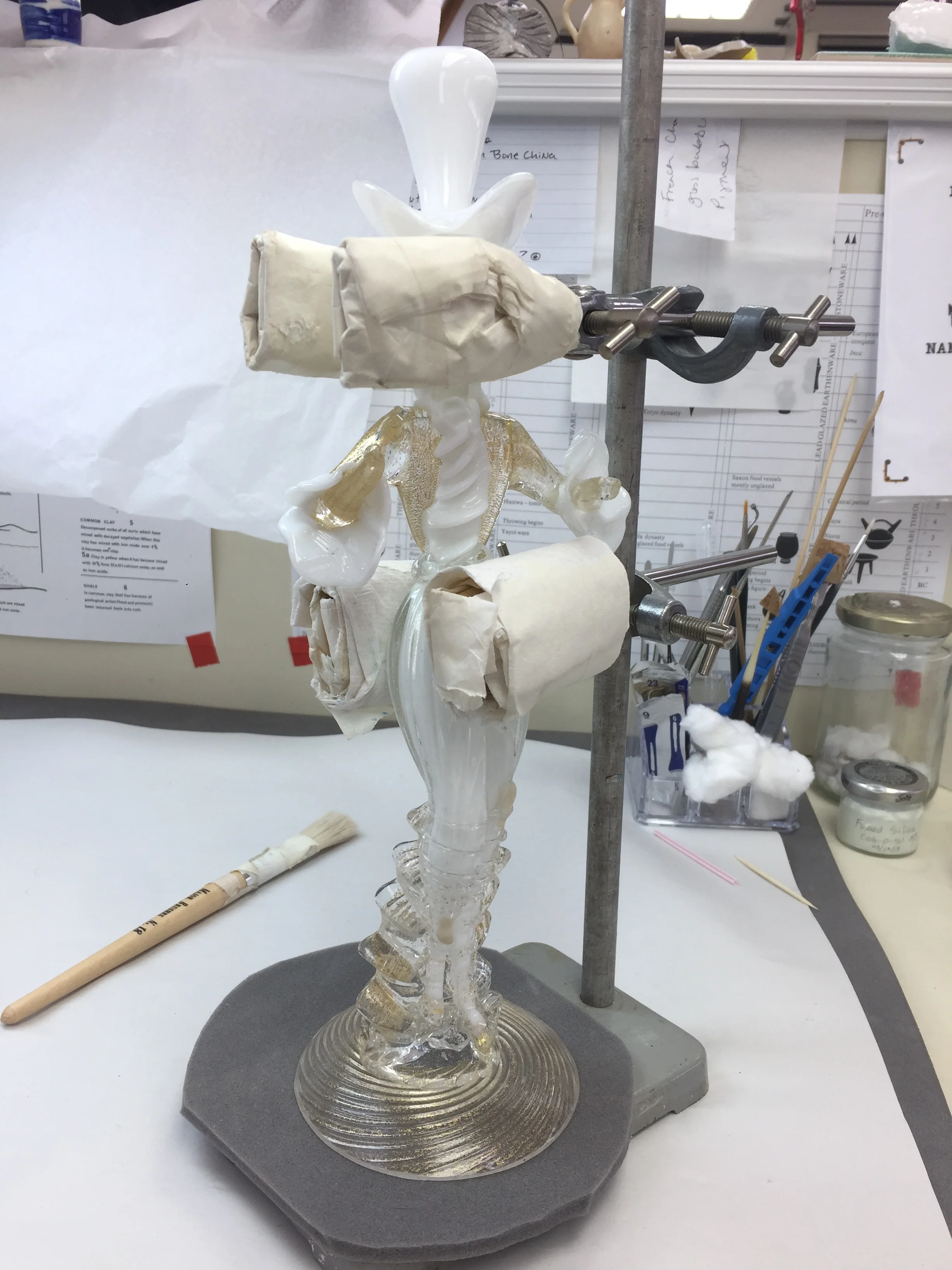  After cleaning, the object was bonded in stages. This image shows the second stage of bonding. The object required support while the adhesive set. 