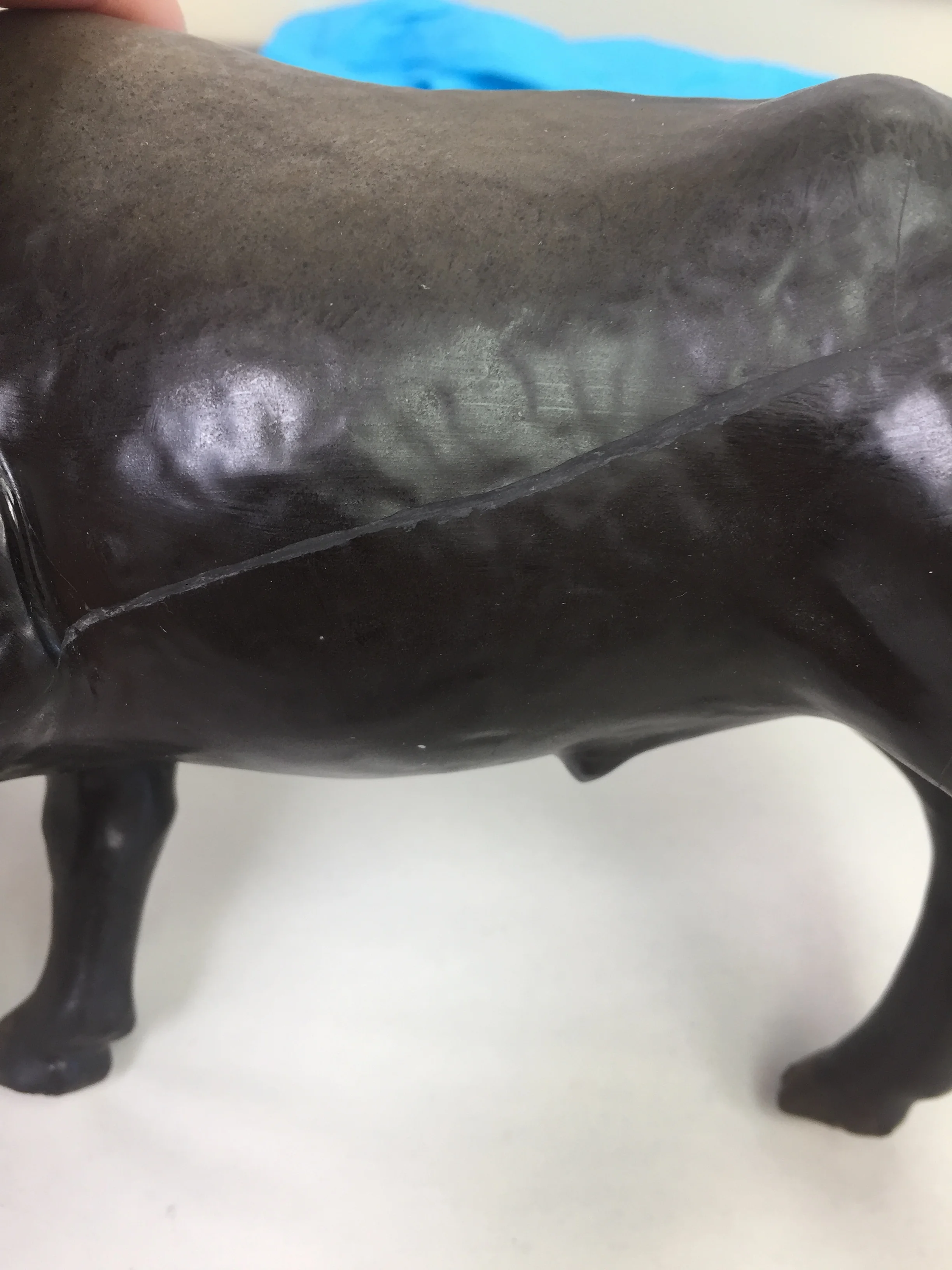  After light cleaning, the cracks were bonded. Because the original damage was caused by tension in the clay, the break-lines could not be perfectly realigned without reintroducing tension into the object. The cracks were then filled with material ti