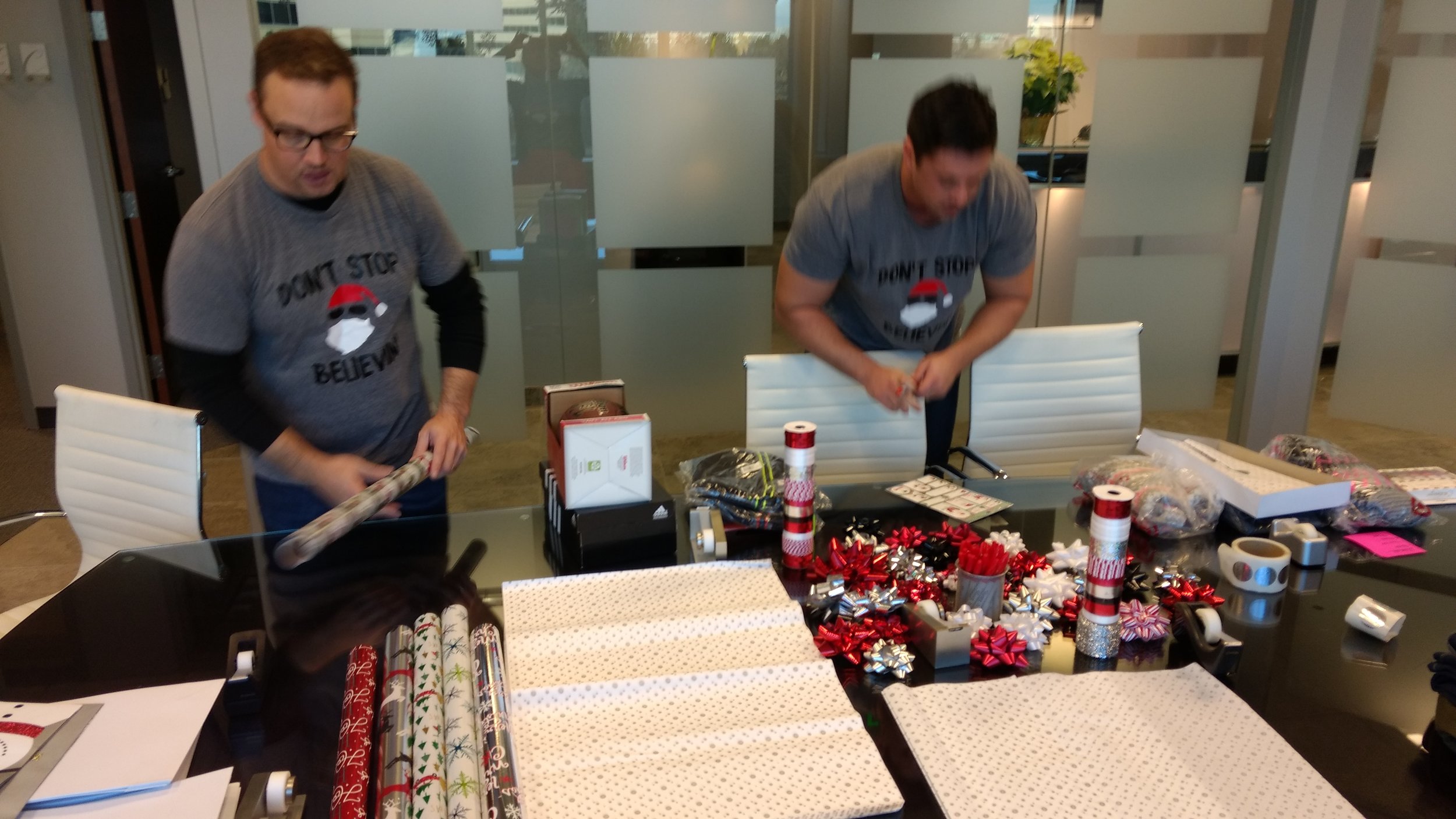 4-Matt and Eric are in deep focus and deep in wrapping paper.jpg