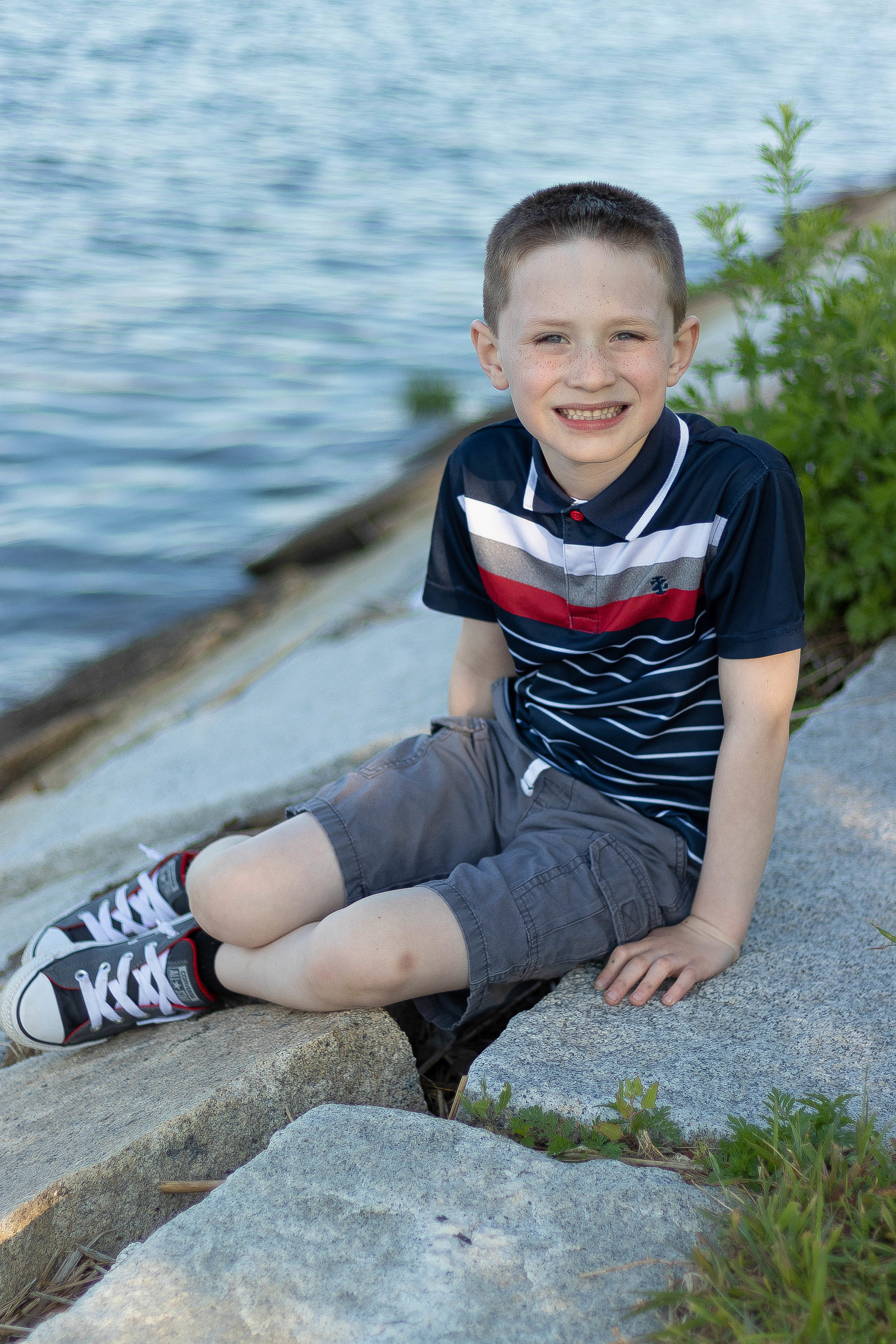 Lifestyle portrait of a young boy in the park in Newburyport, MA by Vision Balm in Charleston, SC.