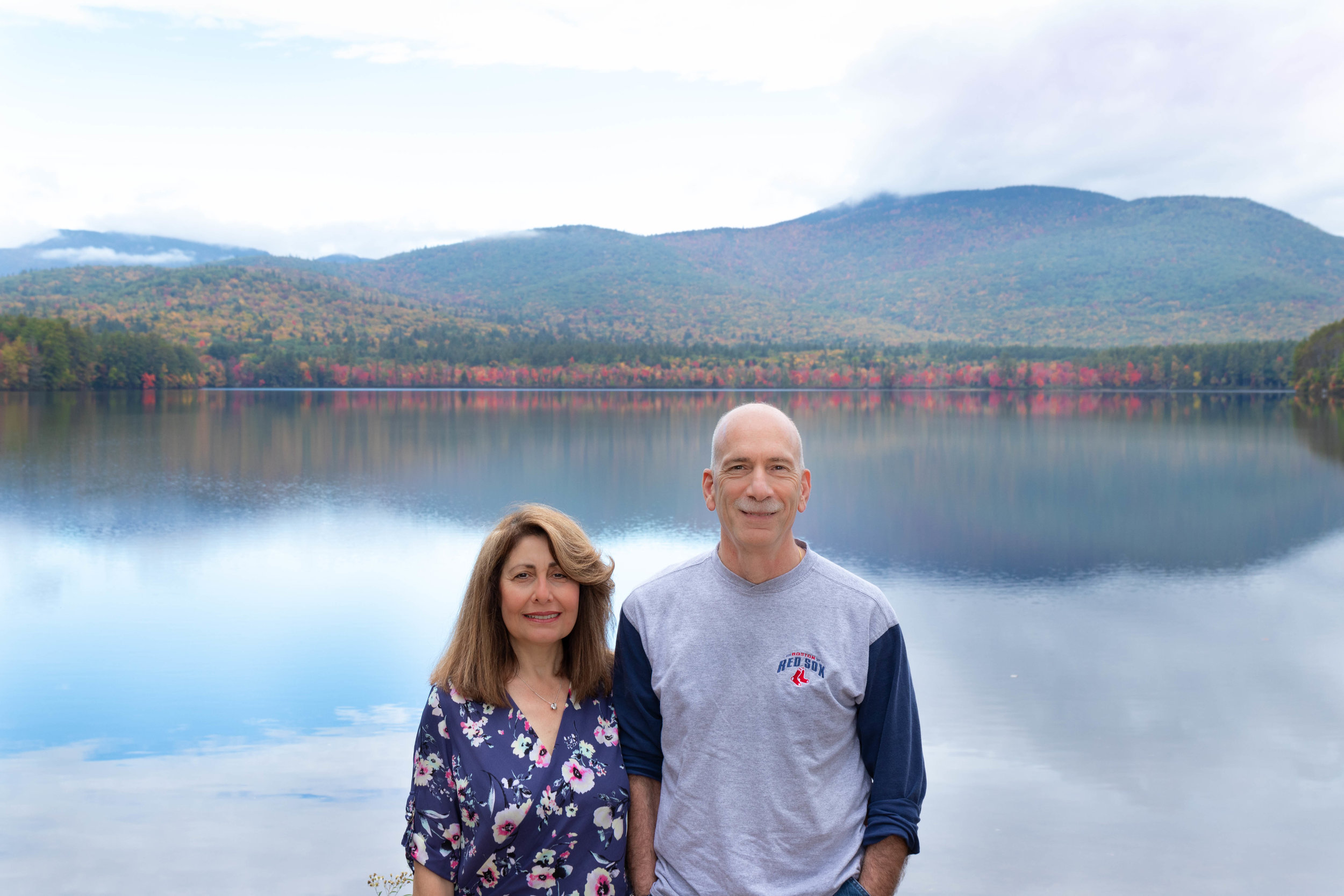 Family portrait of couple on the Kancamagus Highway in North Conway, New Hampshire during fall by Vision Balm in Charleston, SC.