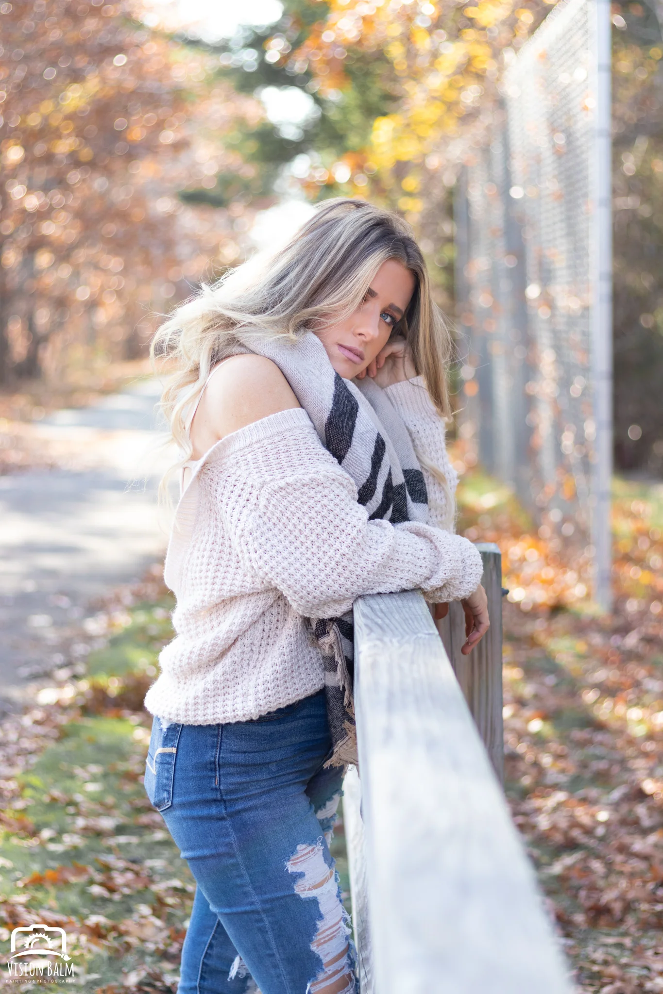 Professional fall portrait photography of model wearing a white sweater and scarf photographed by Vision Balm in Charleston, SC.