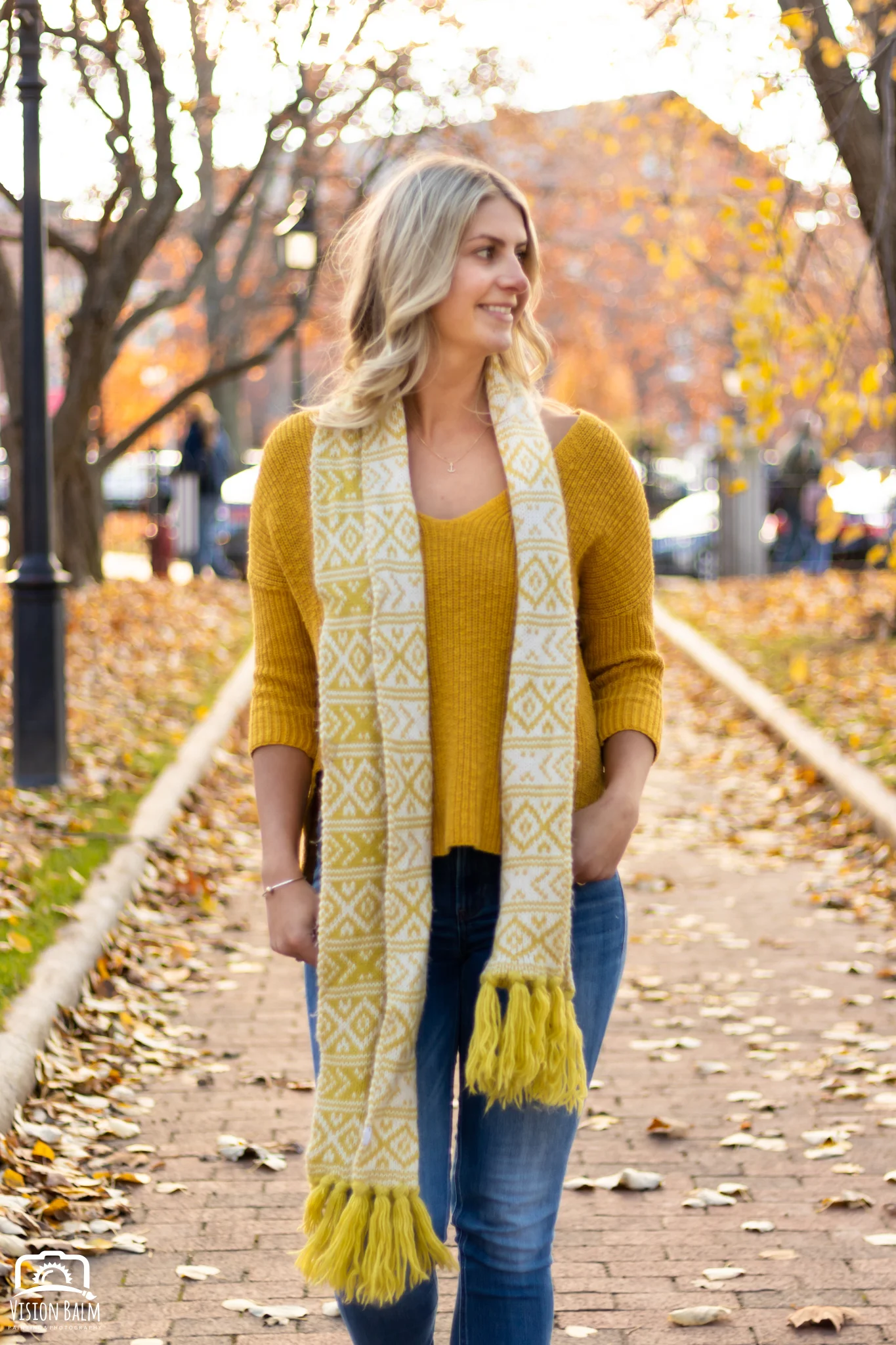 Professional fall portrait photography of model wearing a yellow sweater photographed by Vision Balm in Charleston, SC.