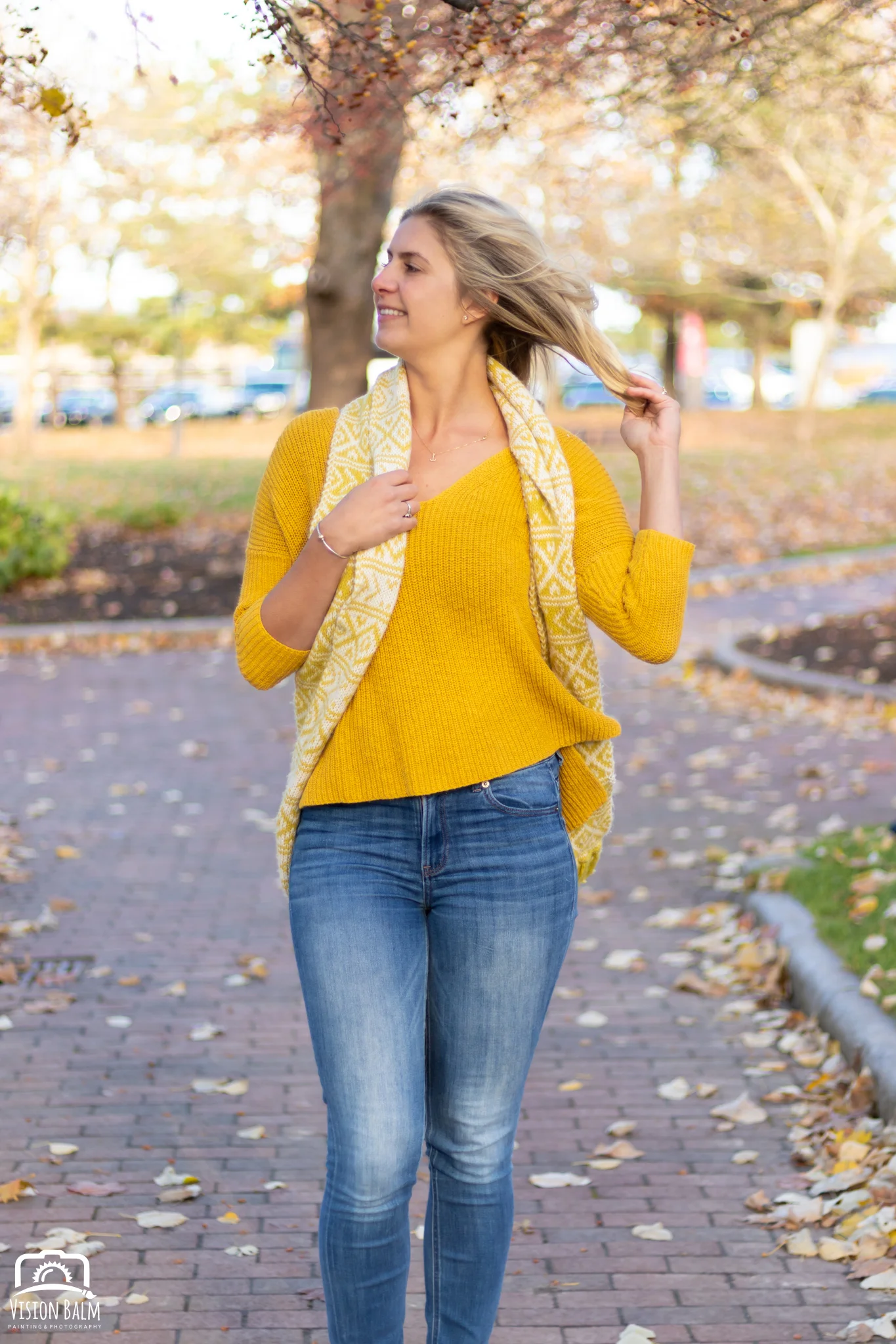Professional fall portrait photography of model wearing a yellow sweater photographed by Vision Balm in Charleston, SC.