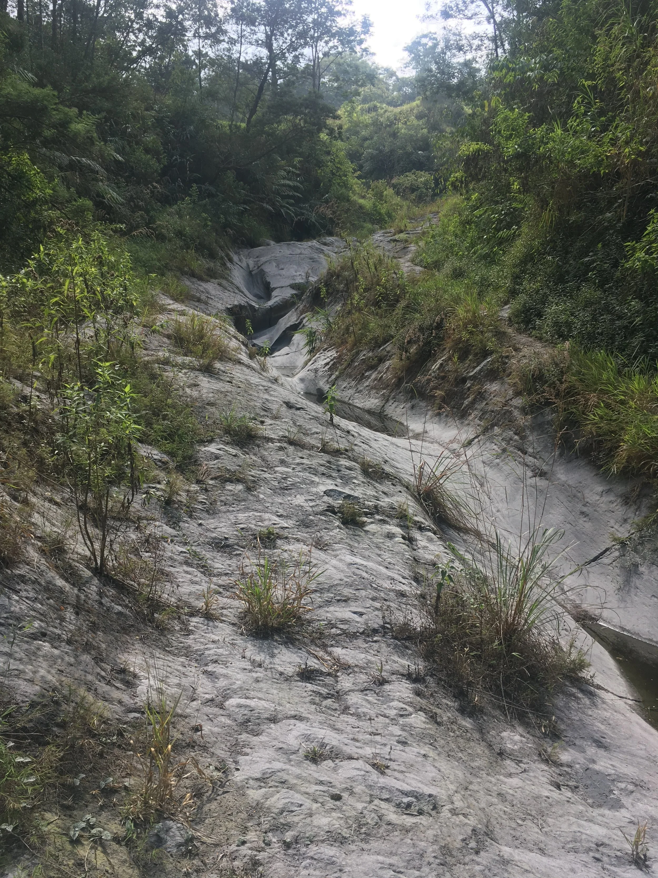   Dried up lava river bed and restricted area on Mt. Merapi . 