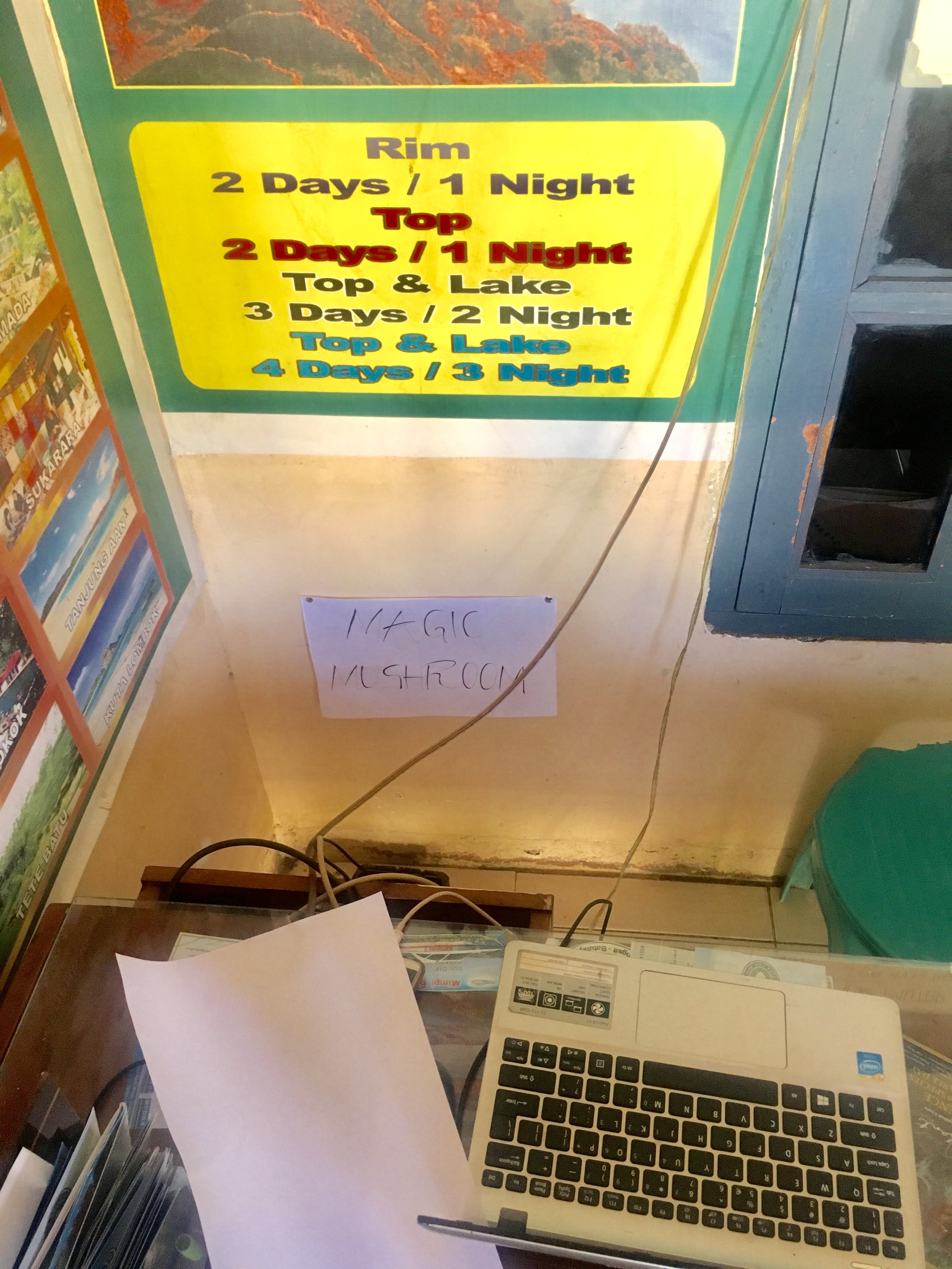   Our reliable travel agency across from our resort. They rented us a car and got us to Gili Air. See sign above for magic mushroom advertisement.  